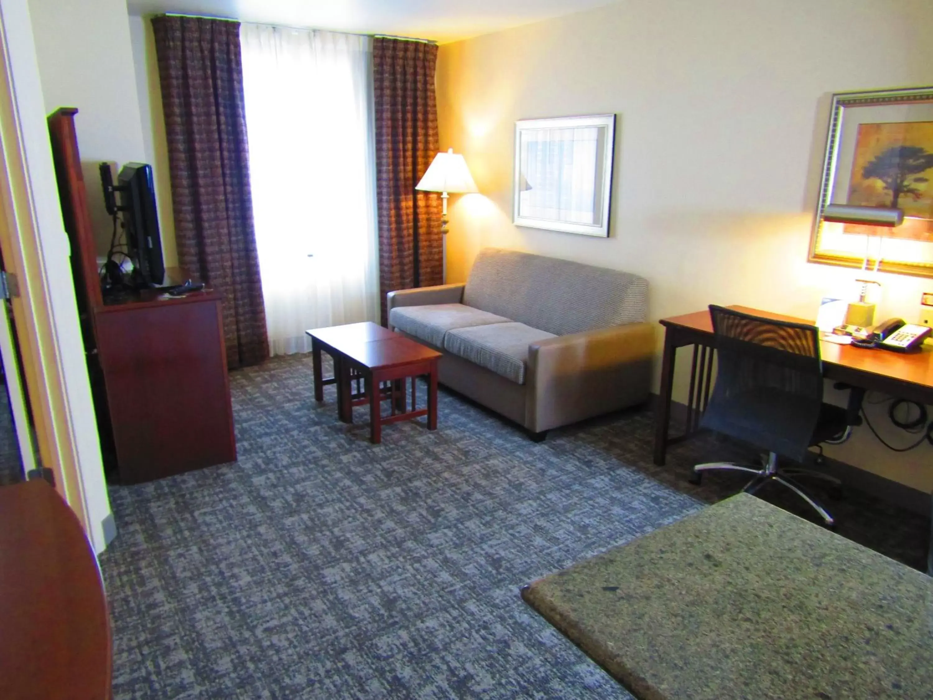 Photo of the whole room, Seating Area in Staybridge Suites Rochester University, an IHG Hotel