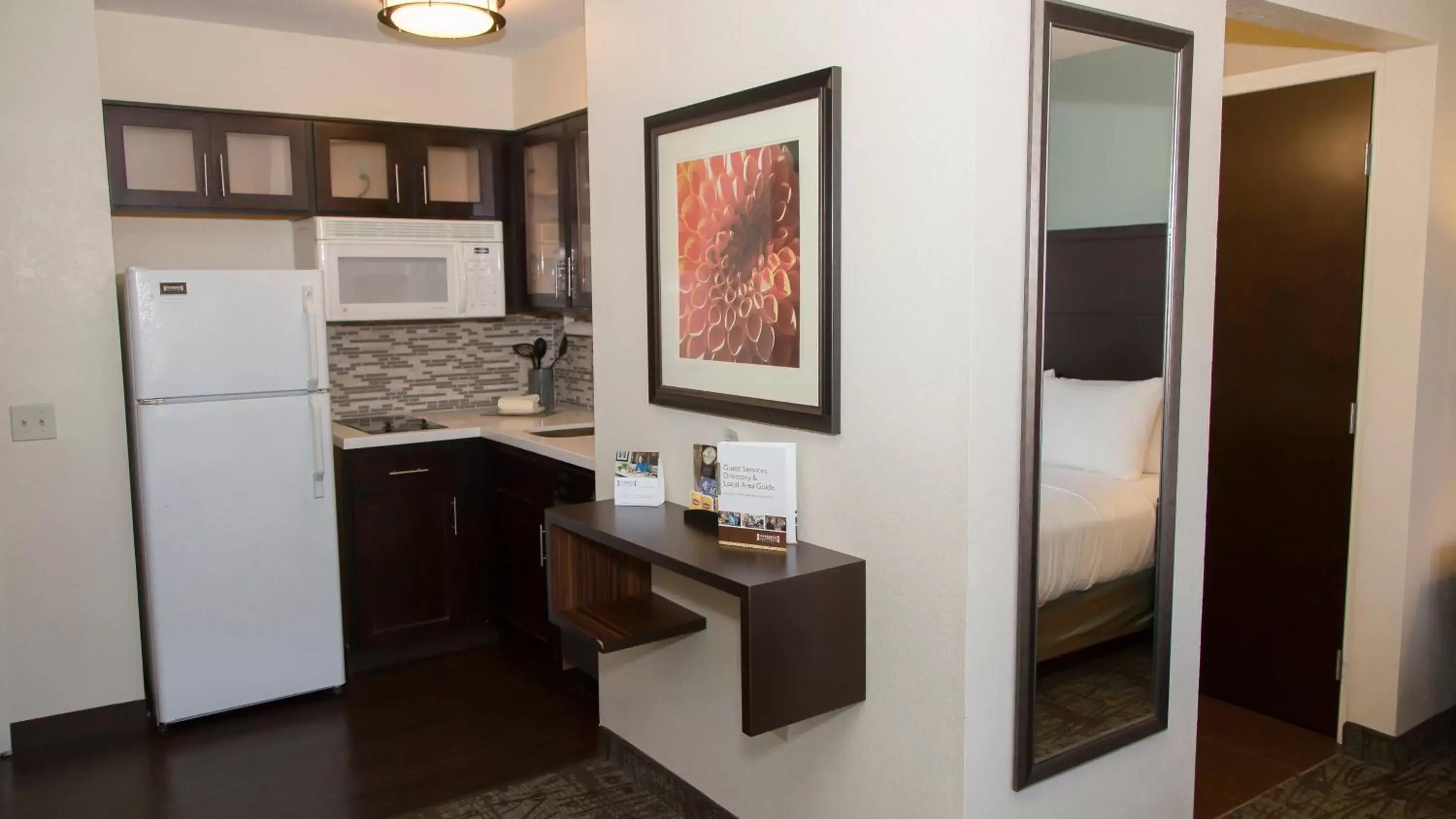 Photo of the whole room, Kitchen/Kitchenette in Staybridge Suites Colorado Springs North, an IHG Hotel