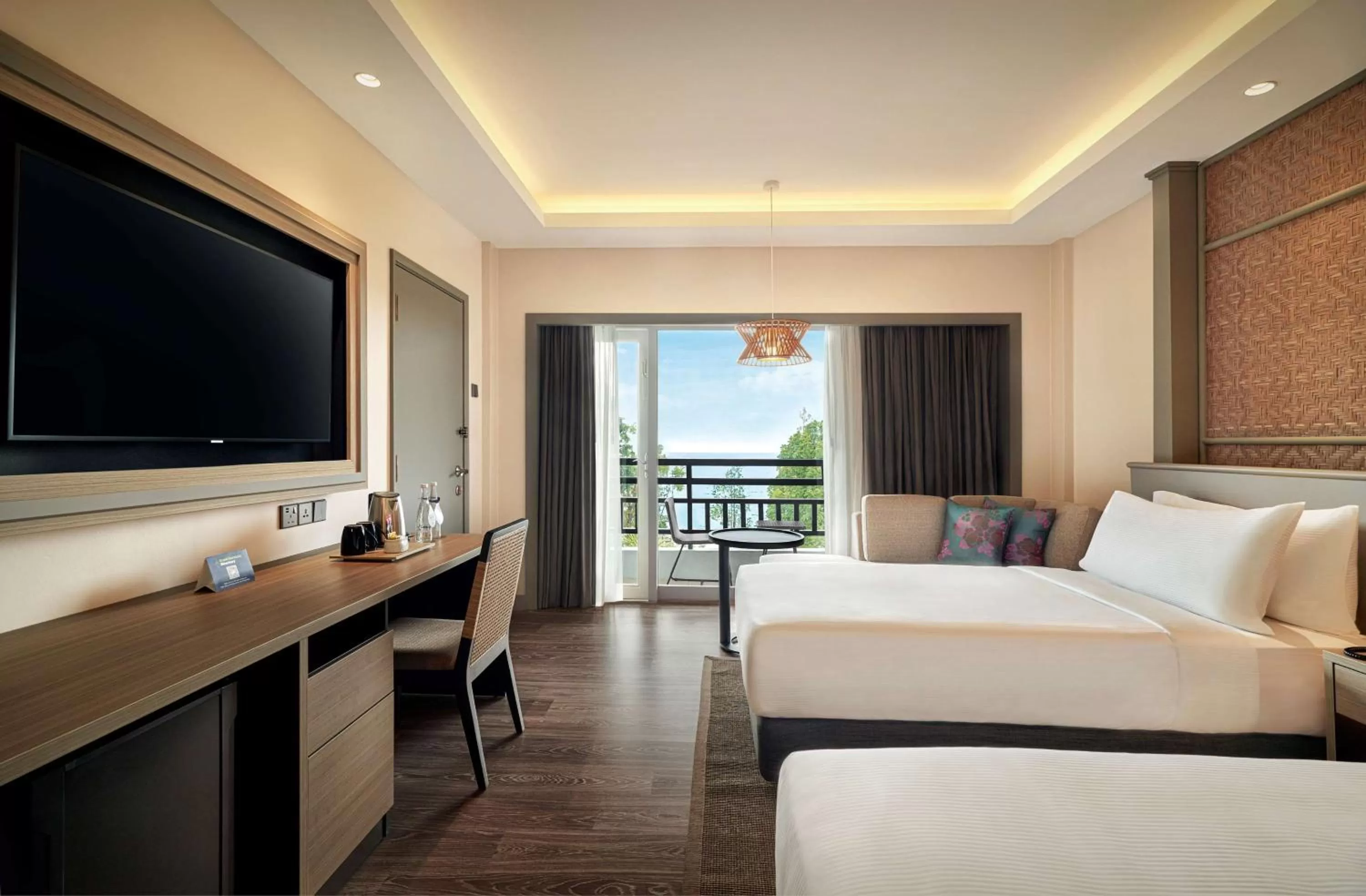 Twin Guest Room with Sea View and Balcony in DoubleTree by Hilton Damai Laut