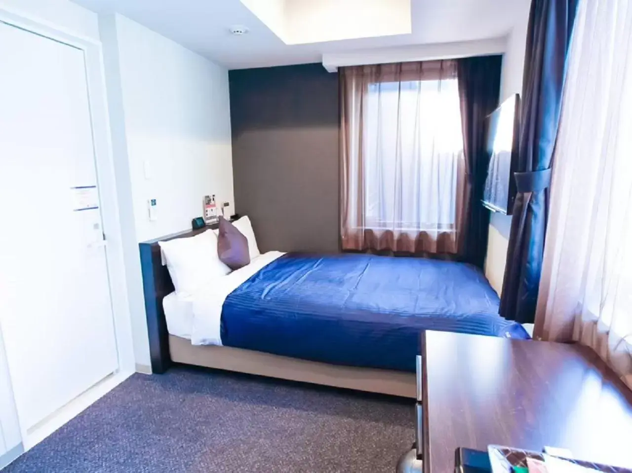 Bed in HOTEL LiVEMAX Umeda WEST