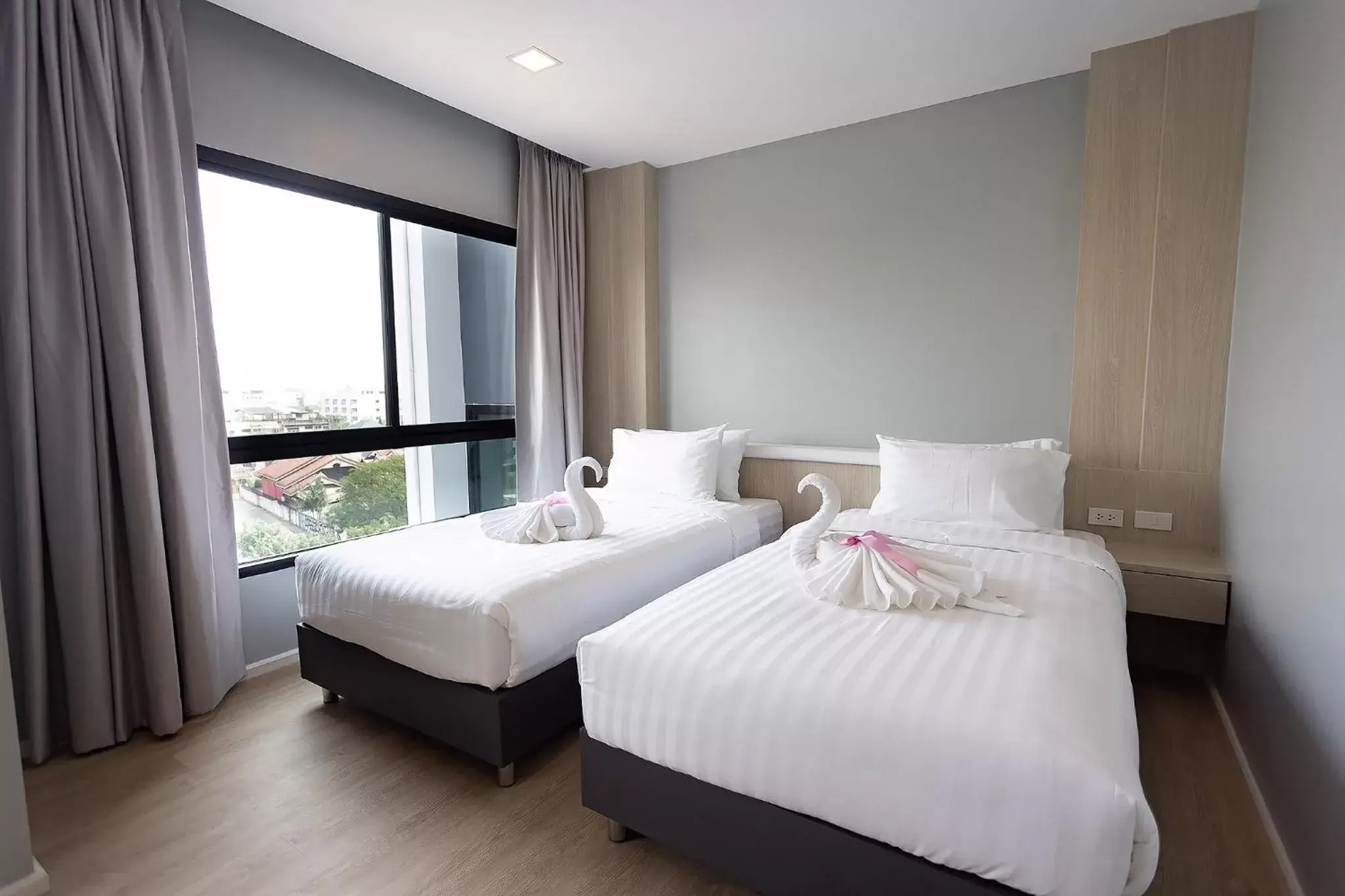Bed in Napa Hotel Ratchaburi