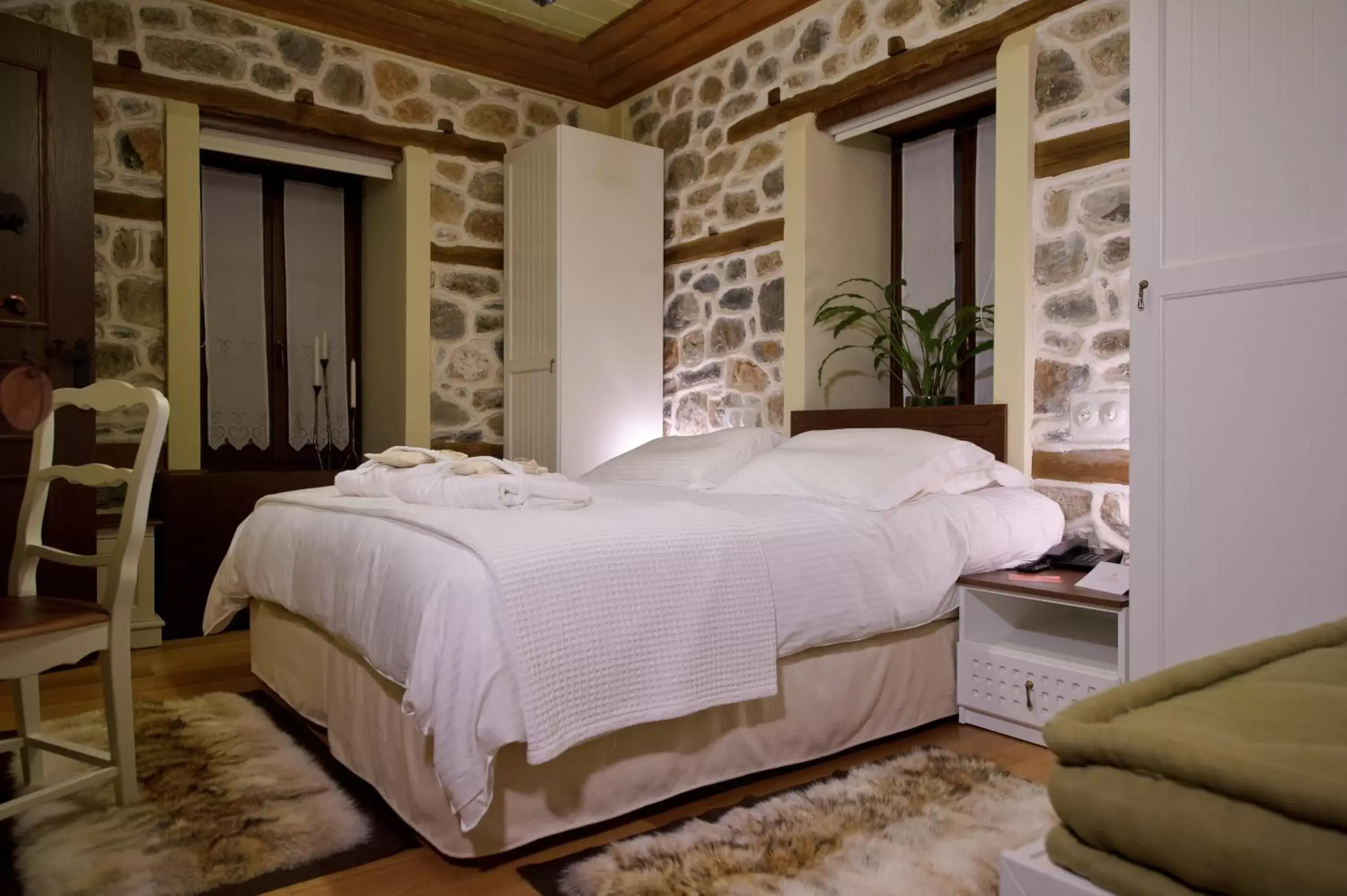 Bed in Orologopoulos Mansion Luxury Hotel