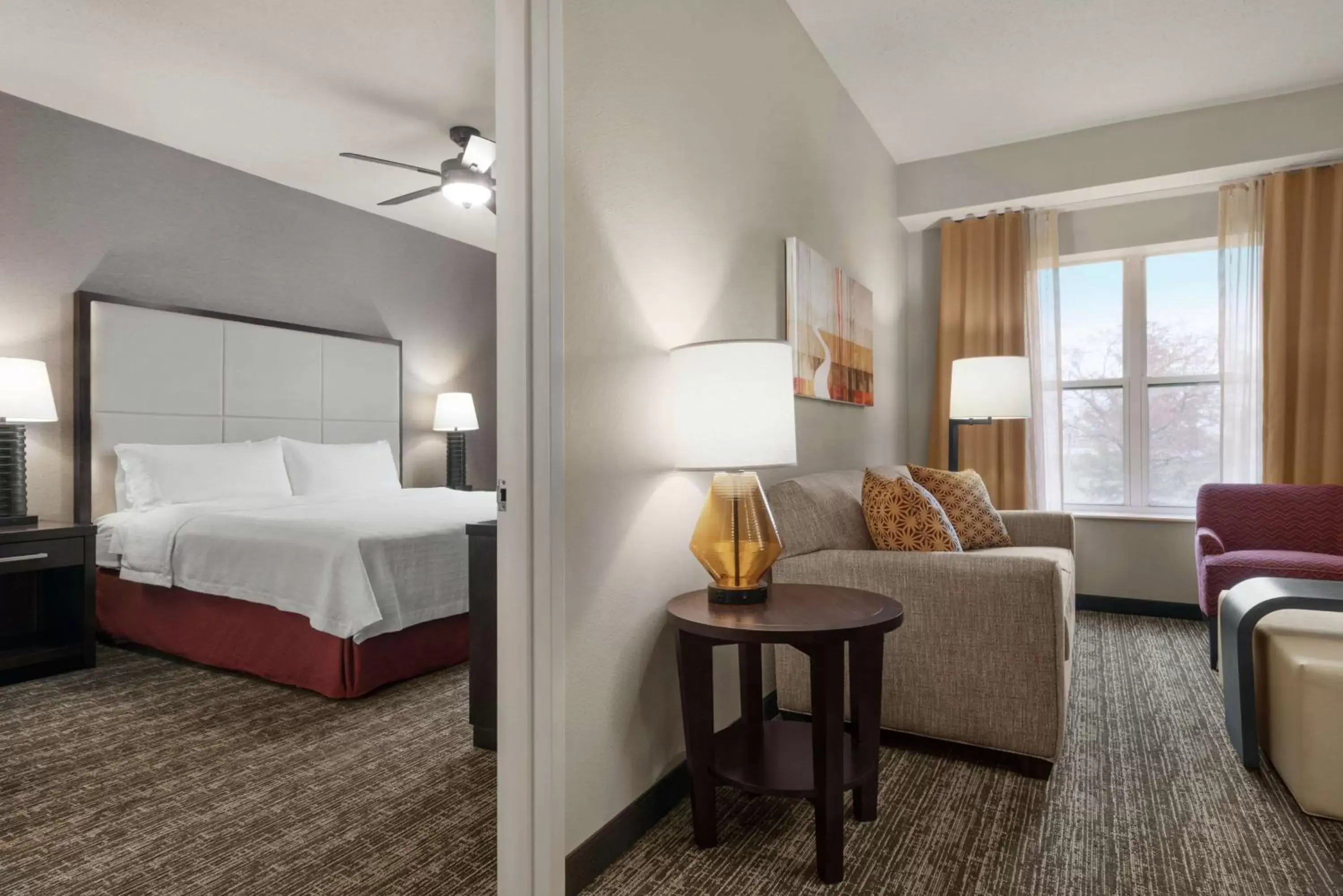 Living room, Bed in Homewood Suites Rochester-Henrietta Living room, Bed in Homewood Suites Rochester-Henrietta