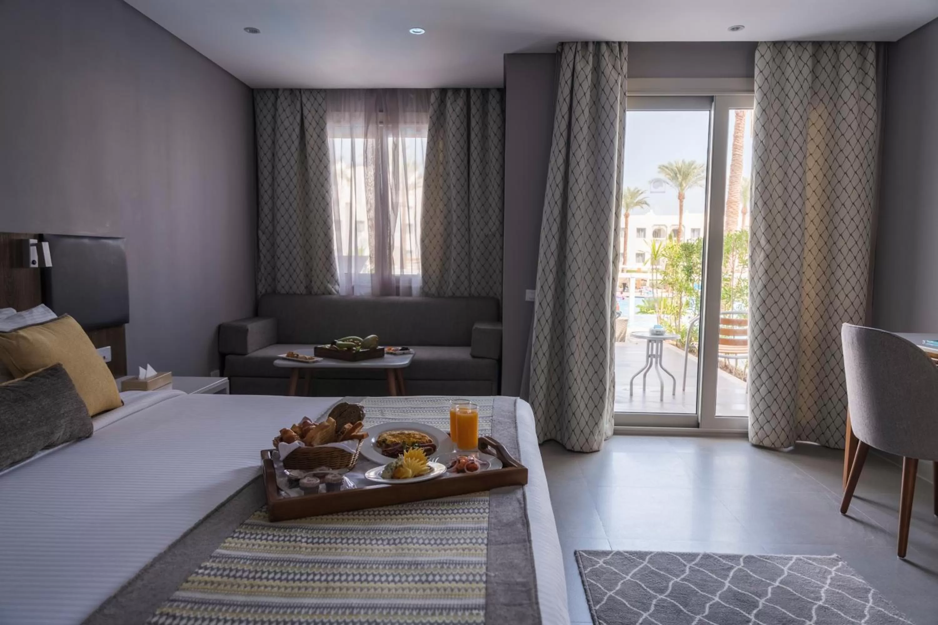 Seating area, Bed in Sunrise Diamond Beach Resort -Grand Select