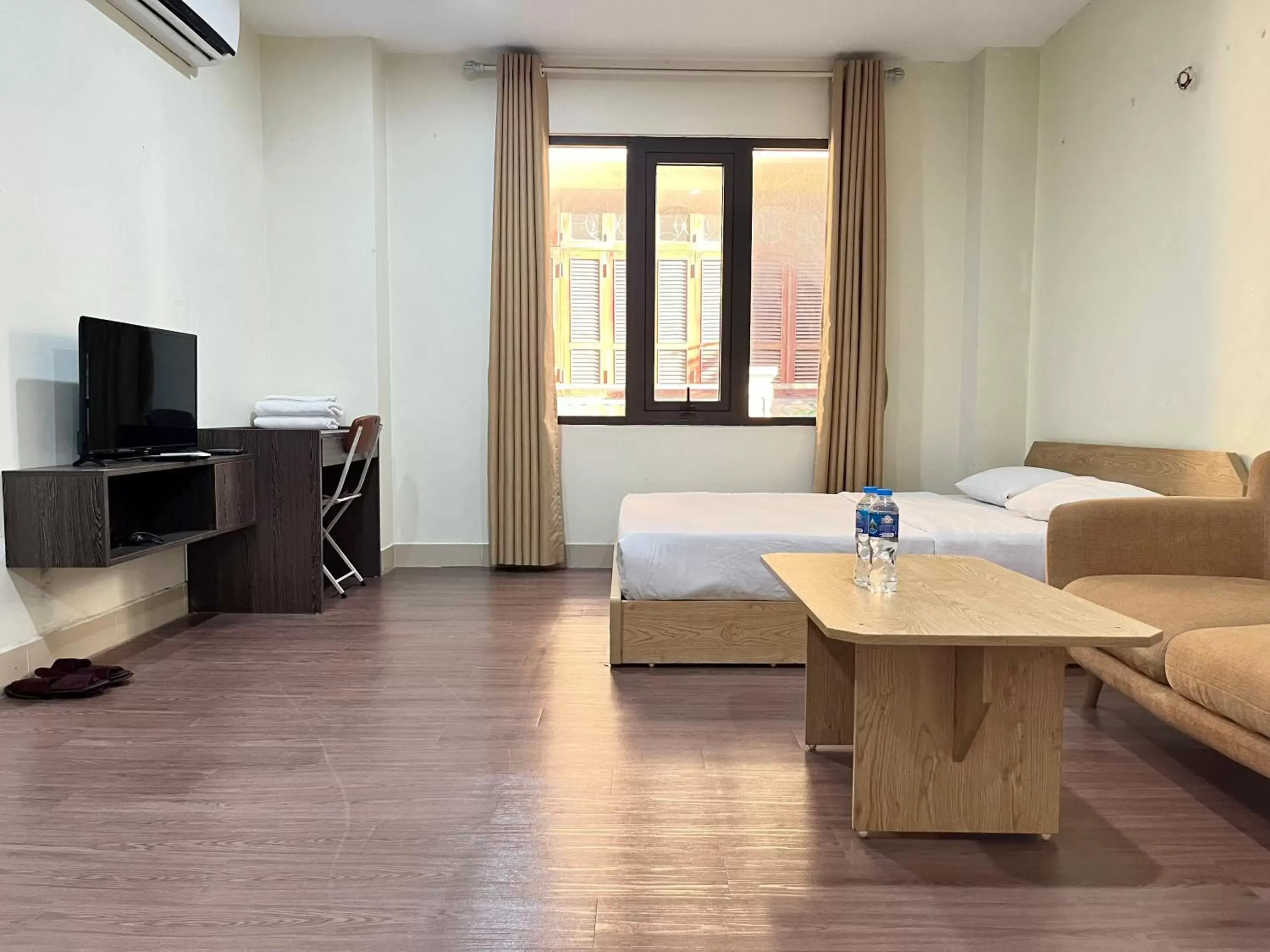 Bed, TV/Entertainment Center in Granda Trung Hoa Apartment