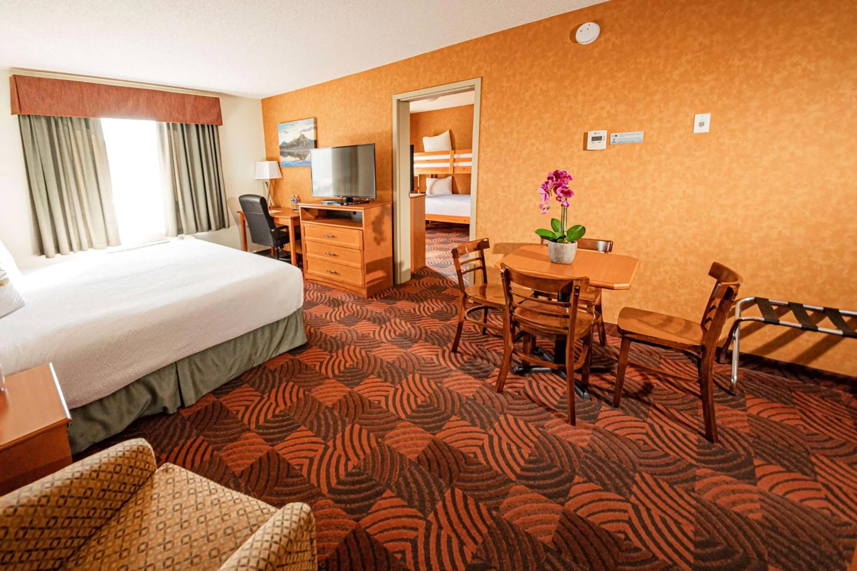 Two-Room King Suite with One King Bed and One Double Bunk Bed - Non-Smoking in SureStay Plus by Best Western Calgary South East