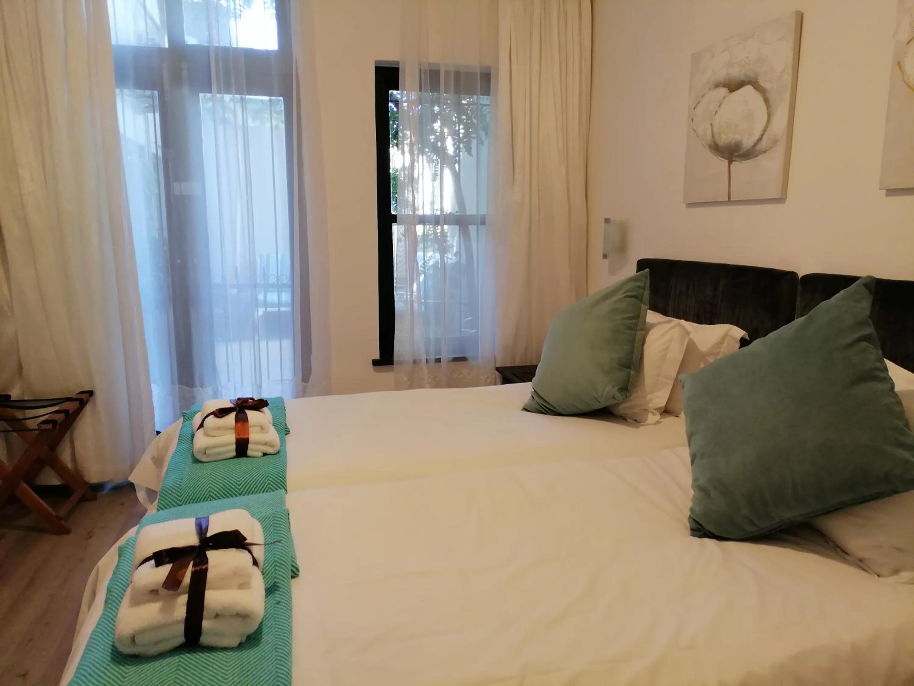 Bed in Point B Guest House -Sustainable Solar Energy