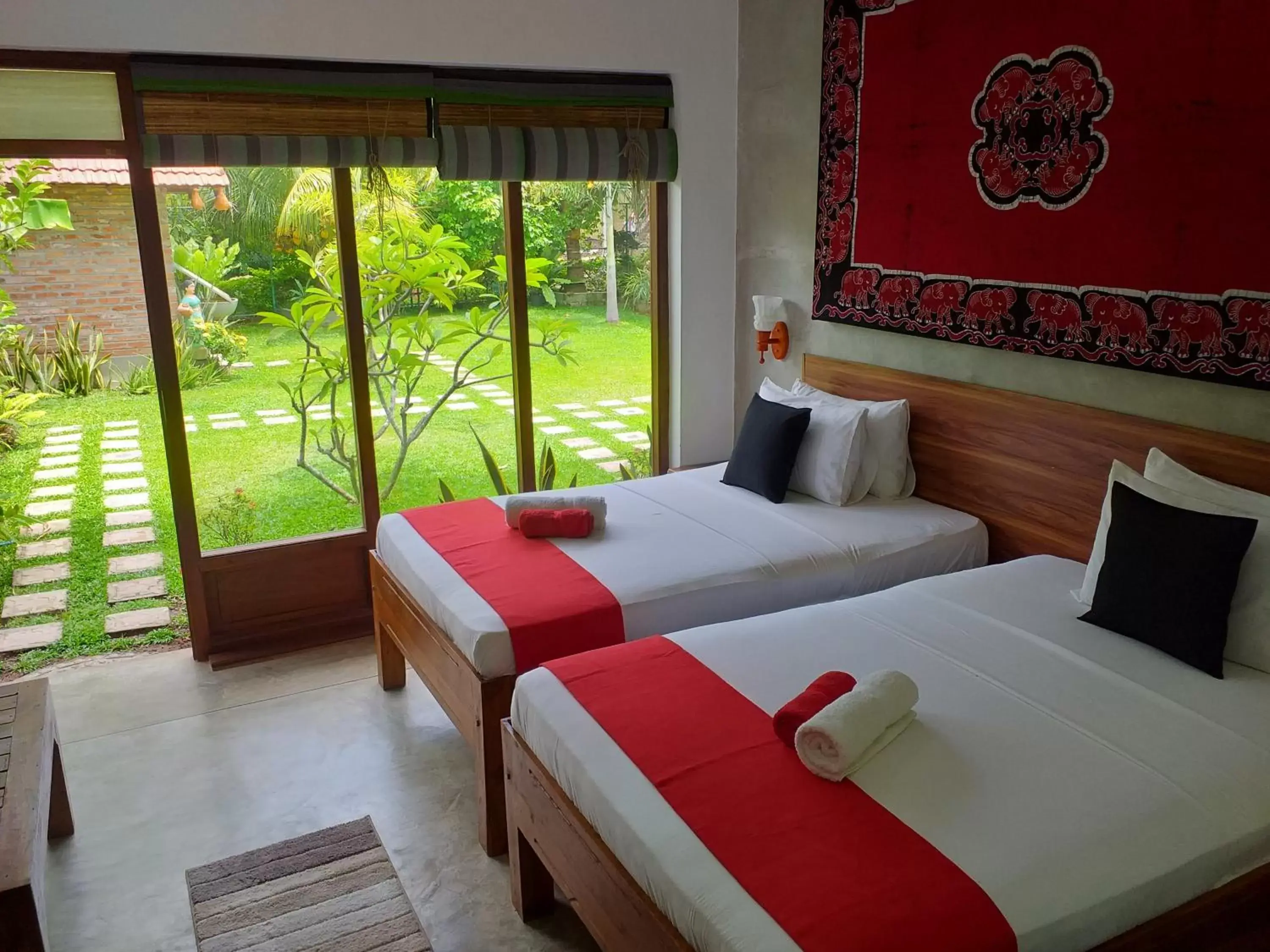 Deluxe Twin Room with Garden & Canal View - single occupancy in Green Wood Villa Negombo Deluxe Twin Room with Garden & Canal View - single occupancy in Green Wood Villa Negombo