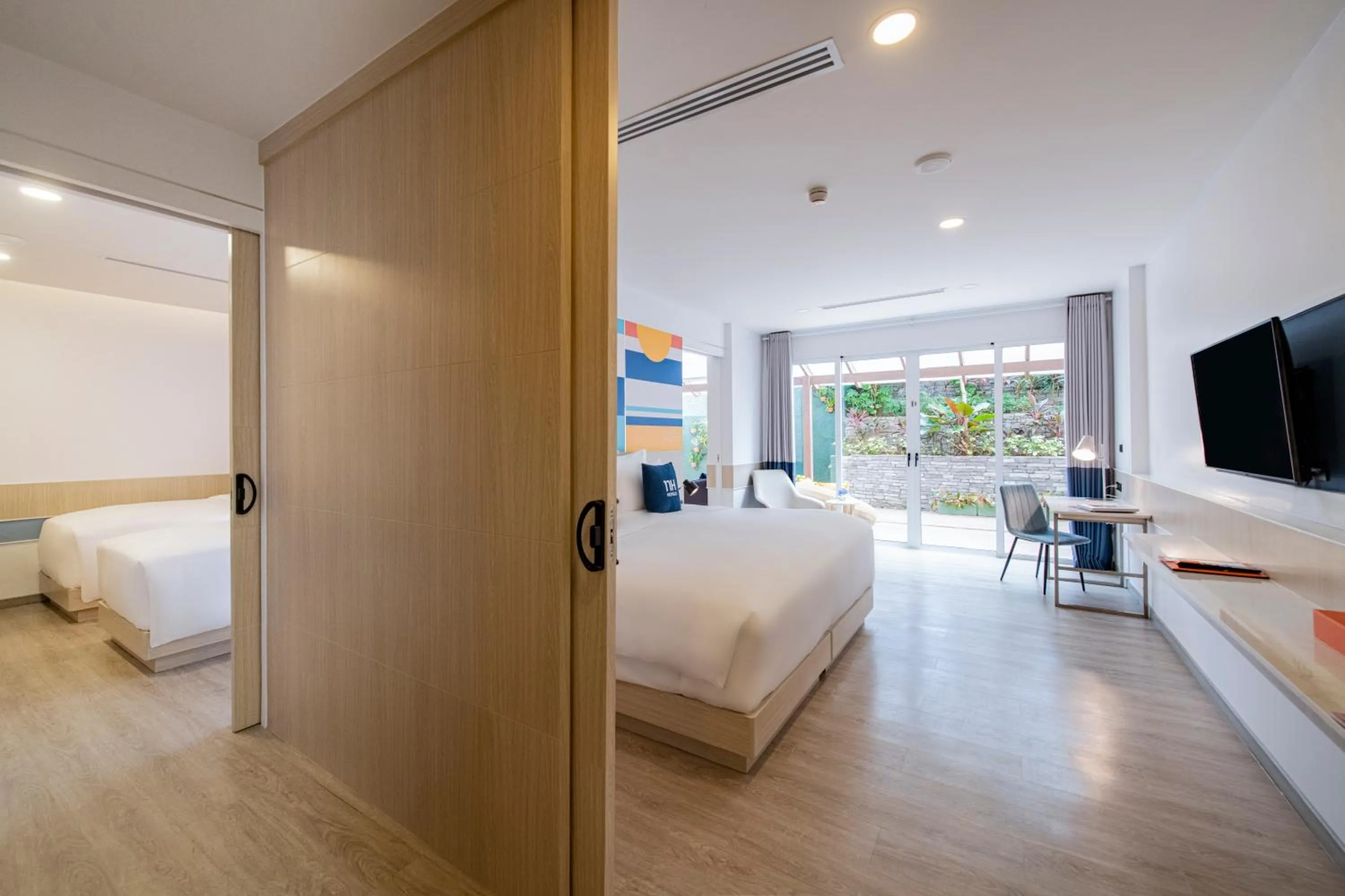 Bed in NH Boat Lagoon Phuket Resort