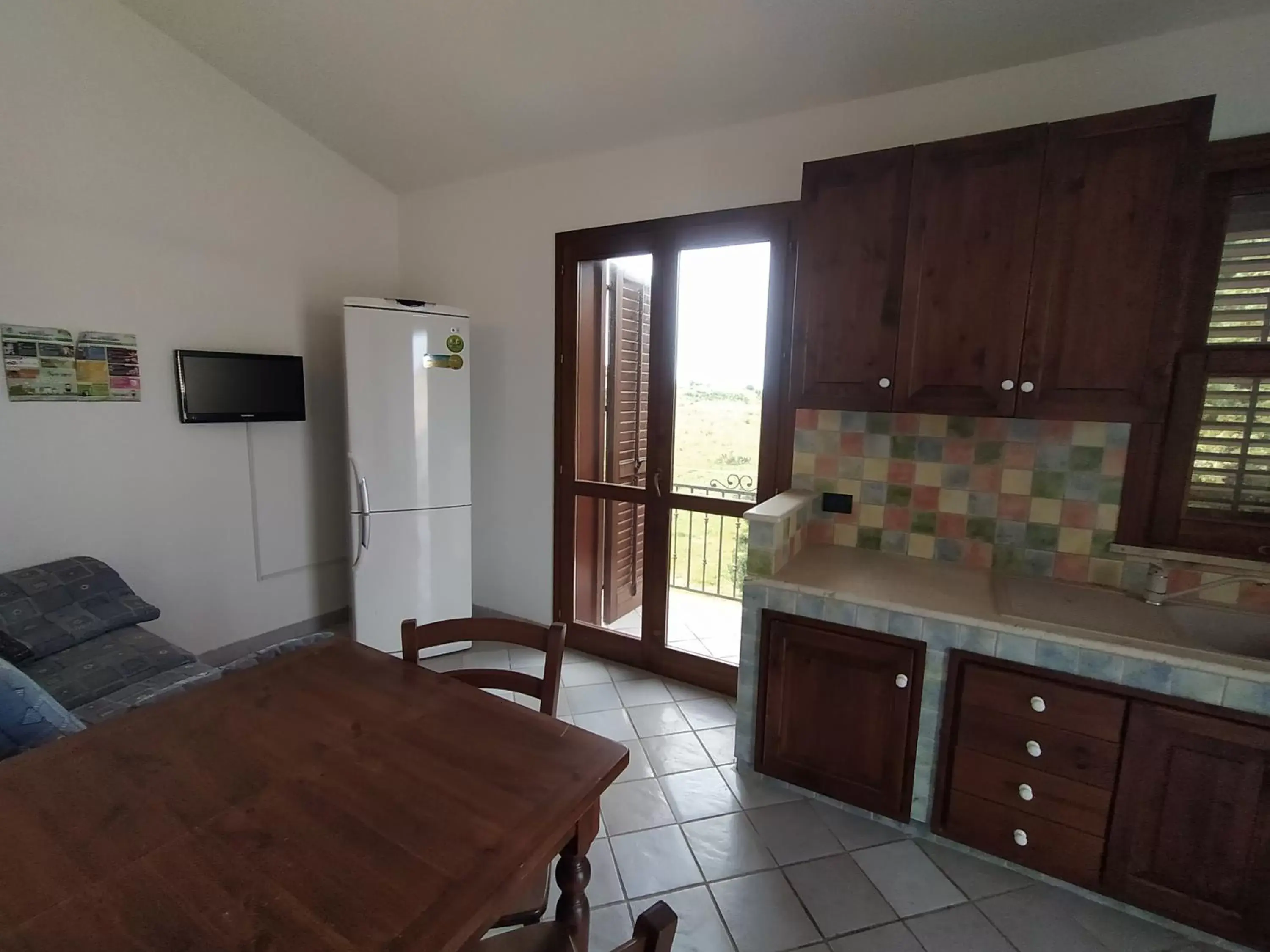 Living room, Kitchen/Kitchenette in SanVitoTour- Residence Il Baglio