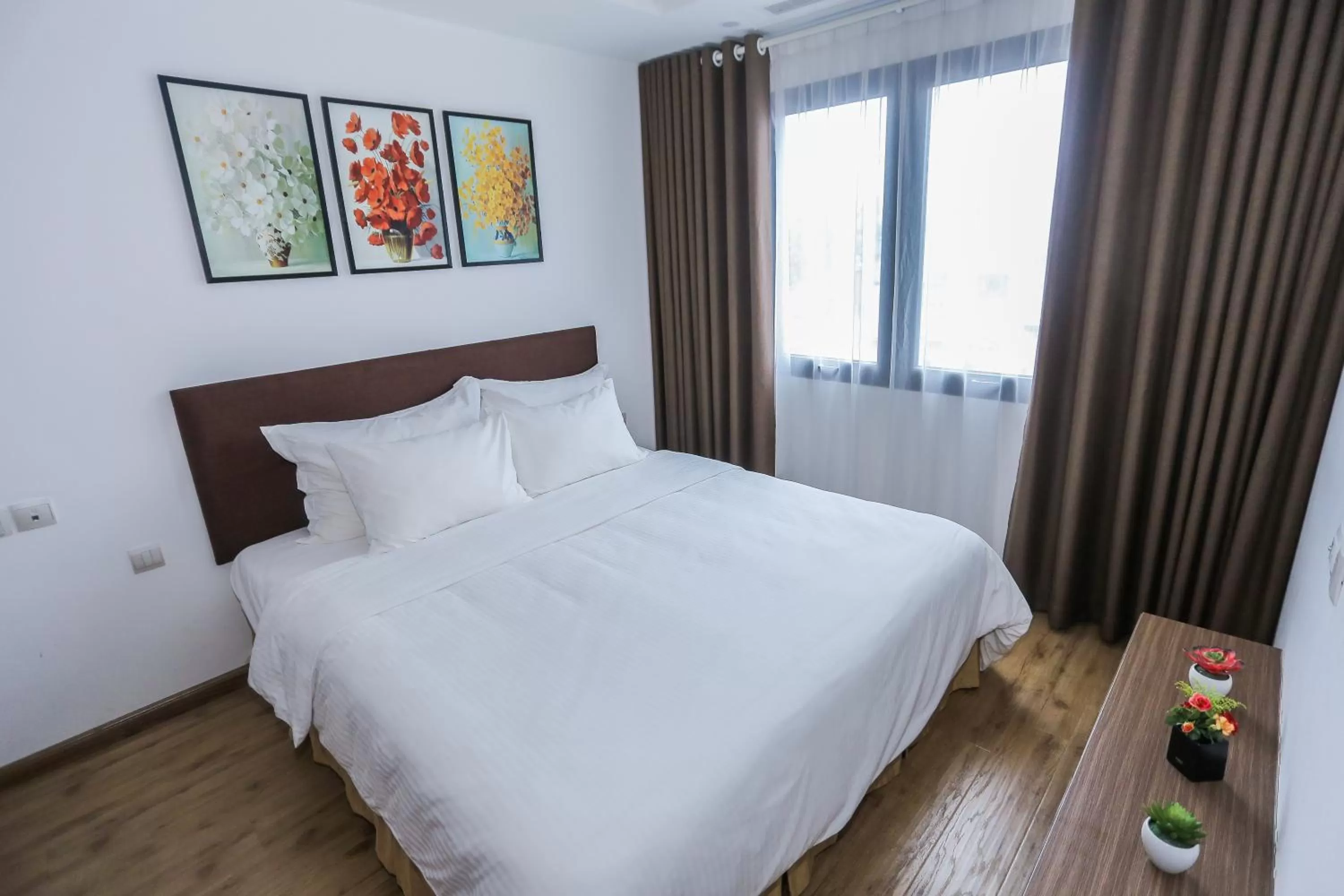 Bed in HNC Premier Hotel & Residences