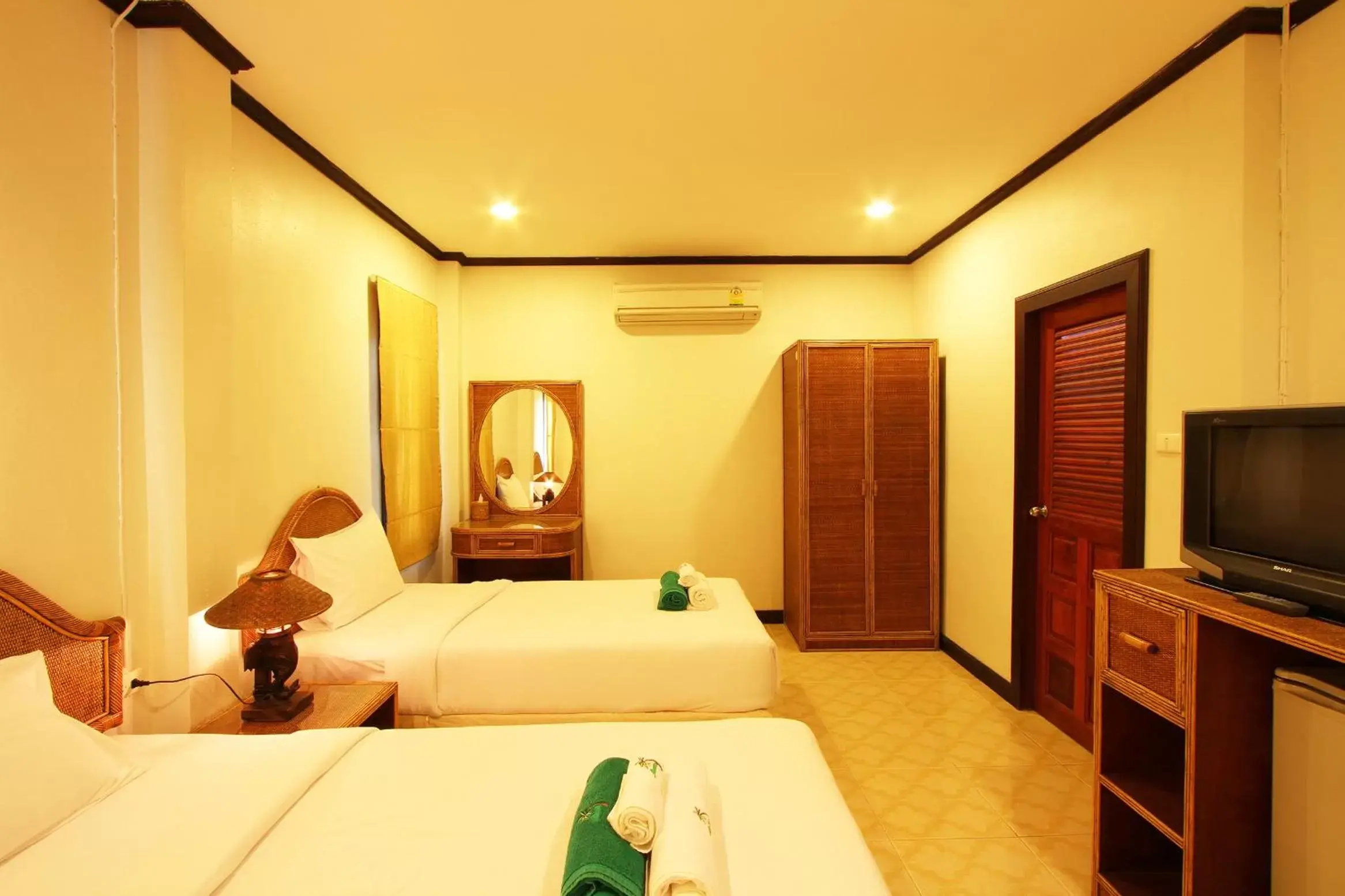 Bed in The Green Beach Resort