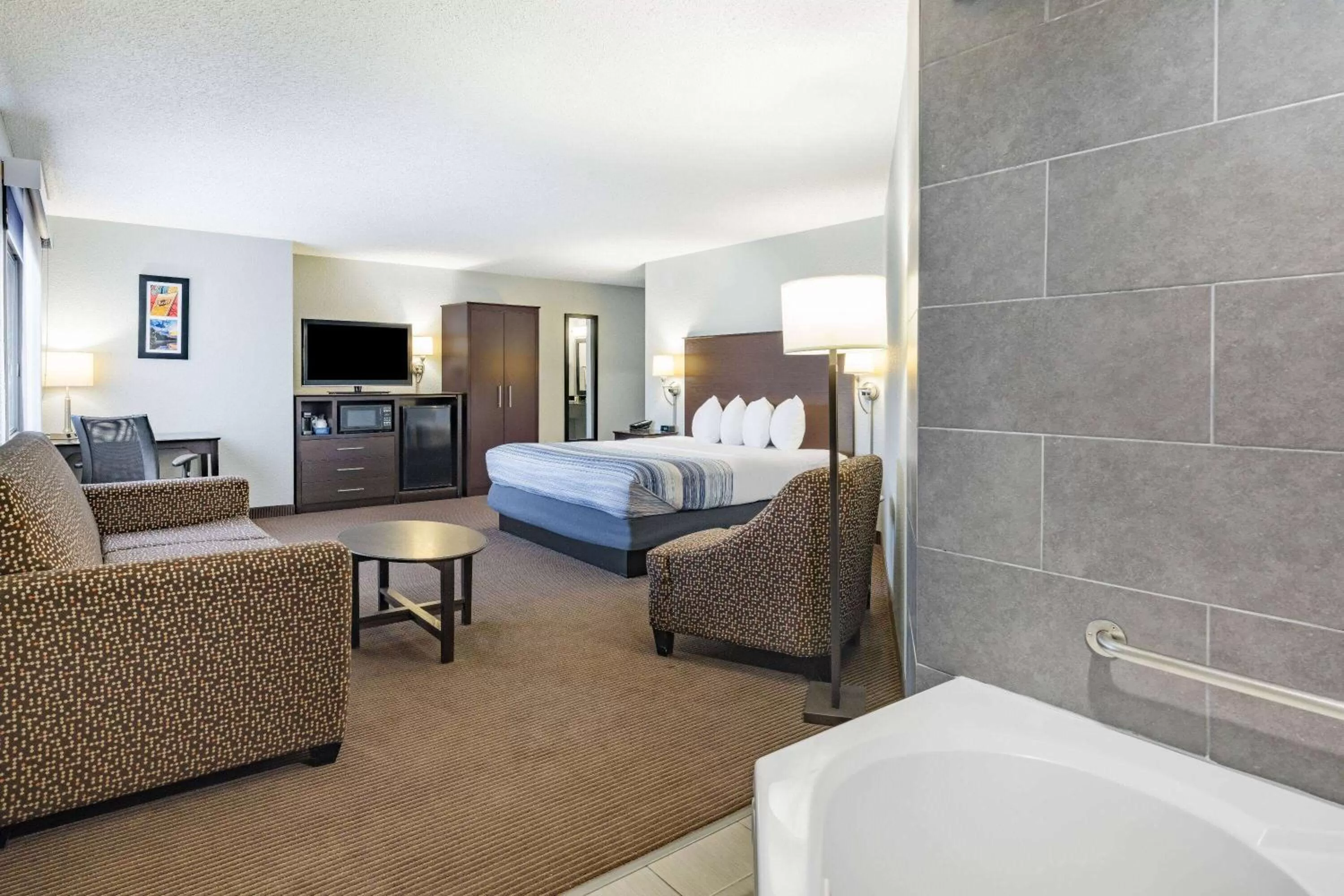 Photo of the whole room, Bed in AmericInn by Wyndham Plover Stevens Point