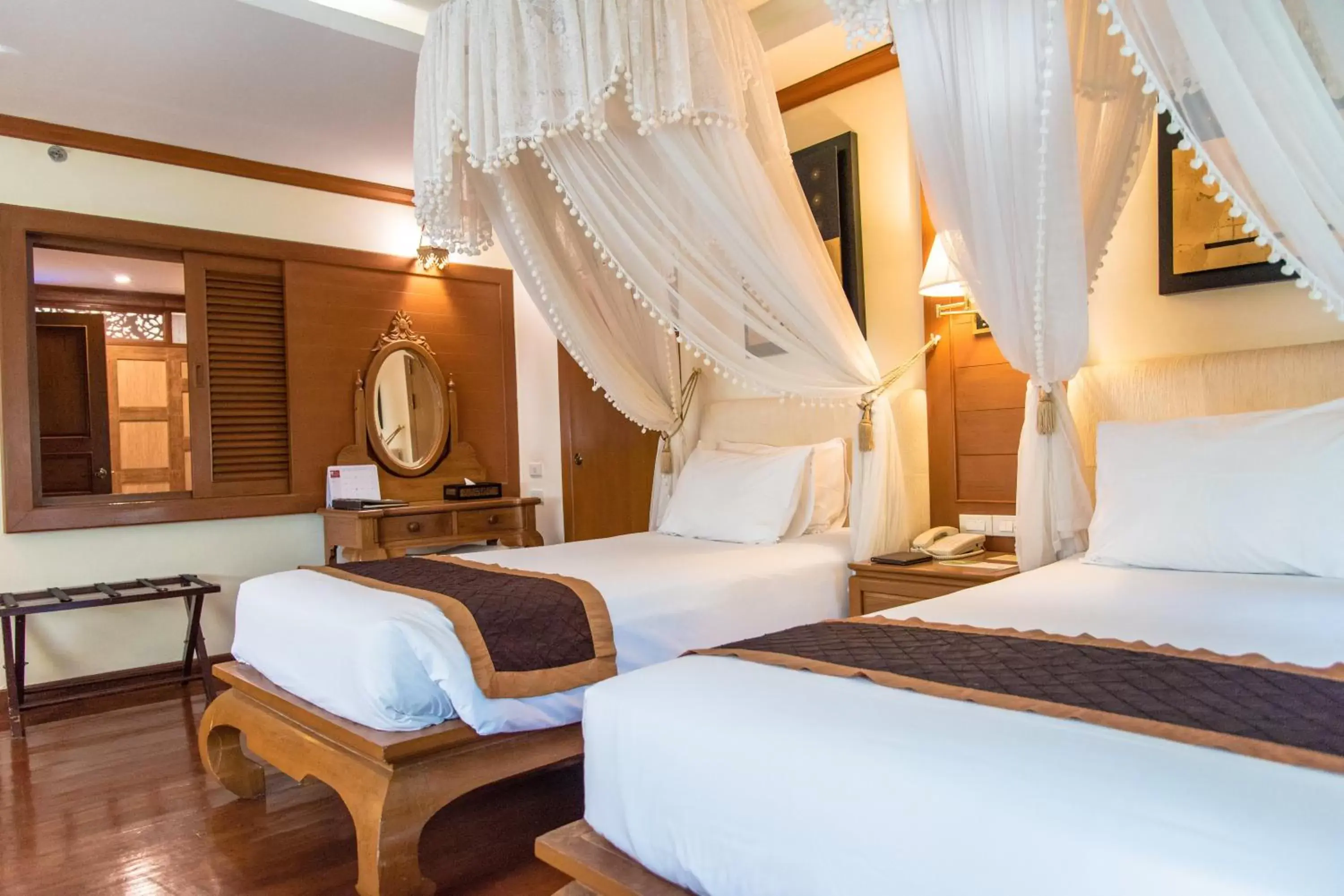 Photo of the whole room, Bed in Centara Khum Phaya Resort & Spa, Centara Boutique Collection