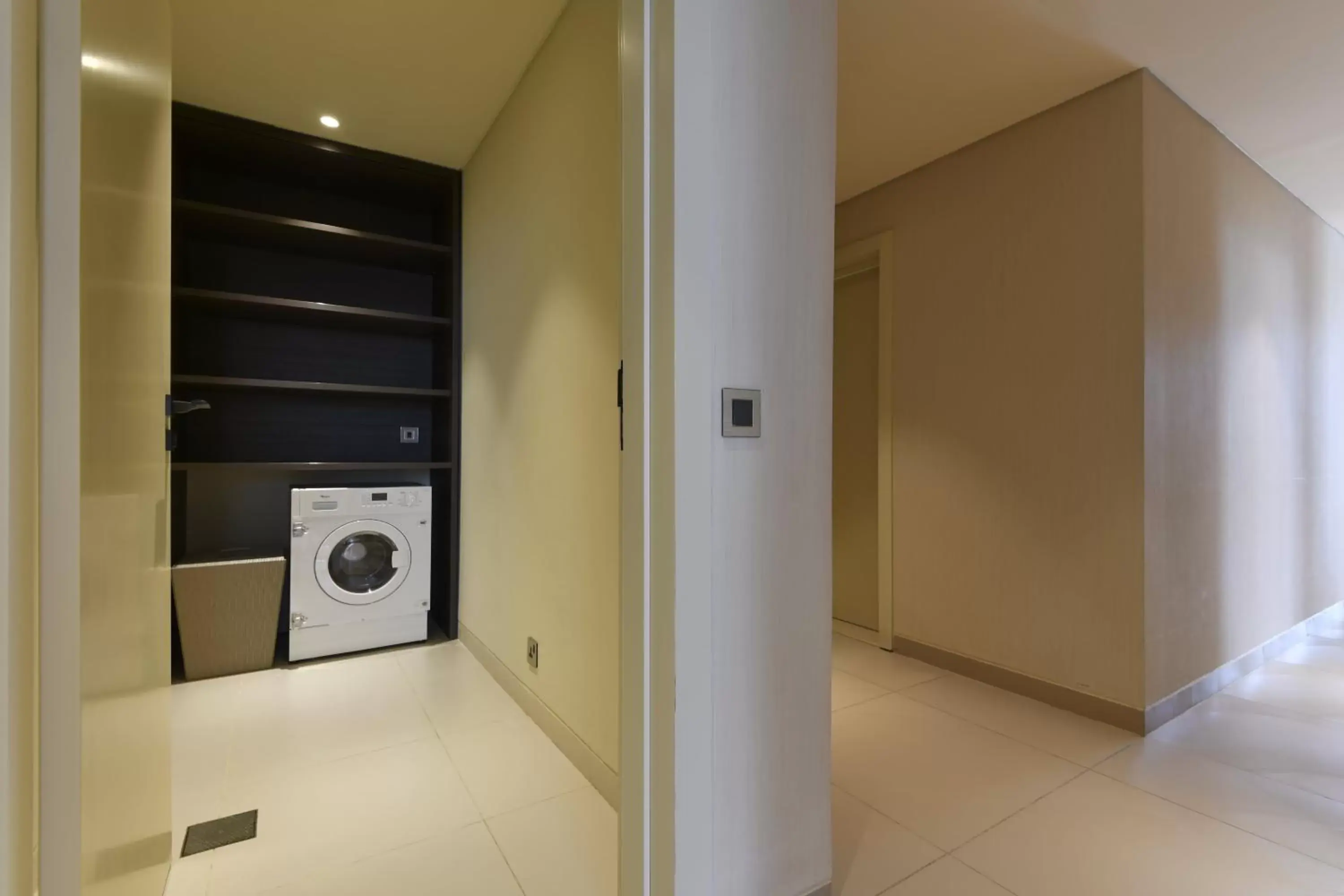 laundry, Bathroom in voco Doha West Bay Suites, an IHG Hotel