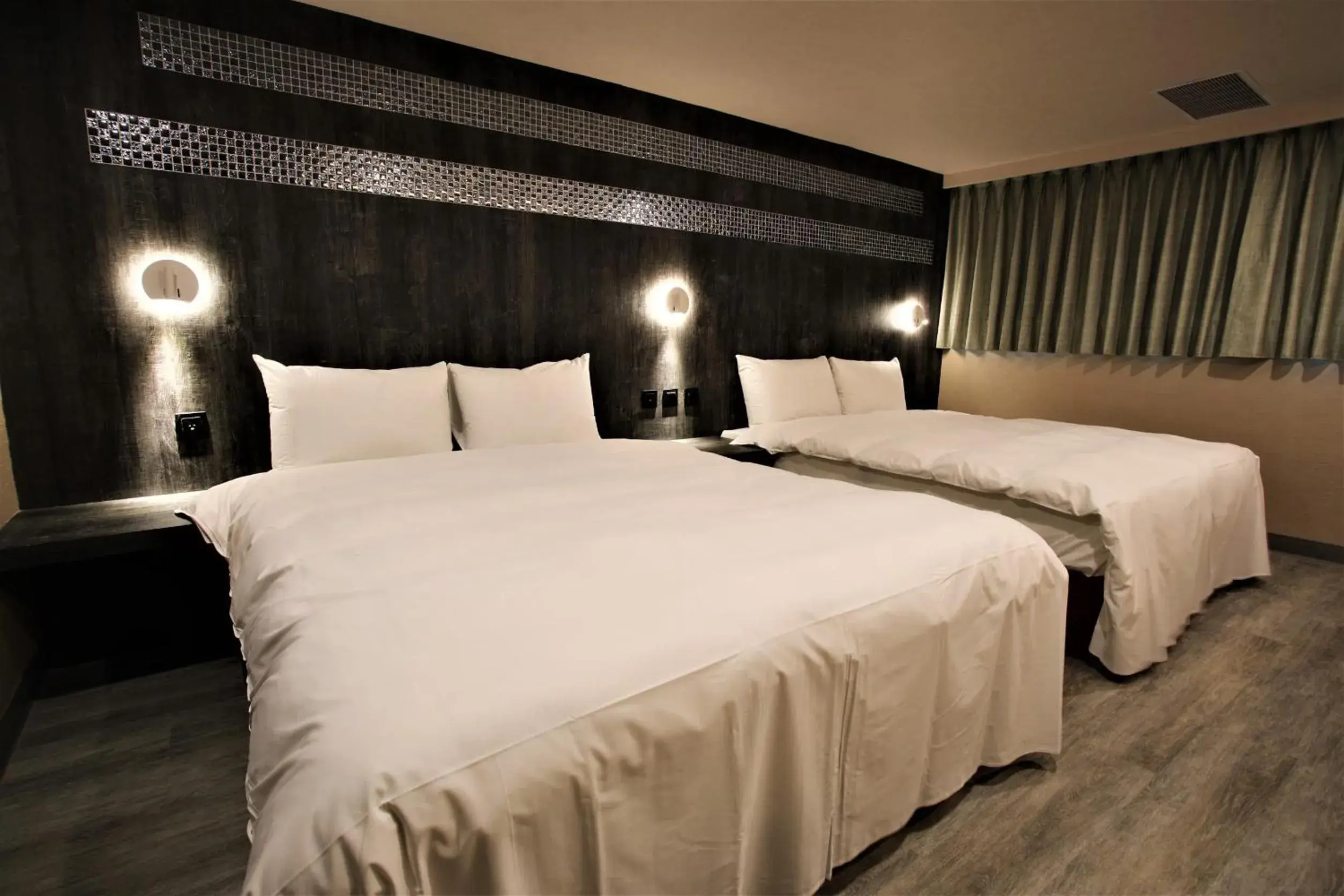 Bed in Goldenhome Hotel