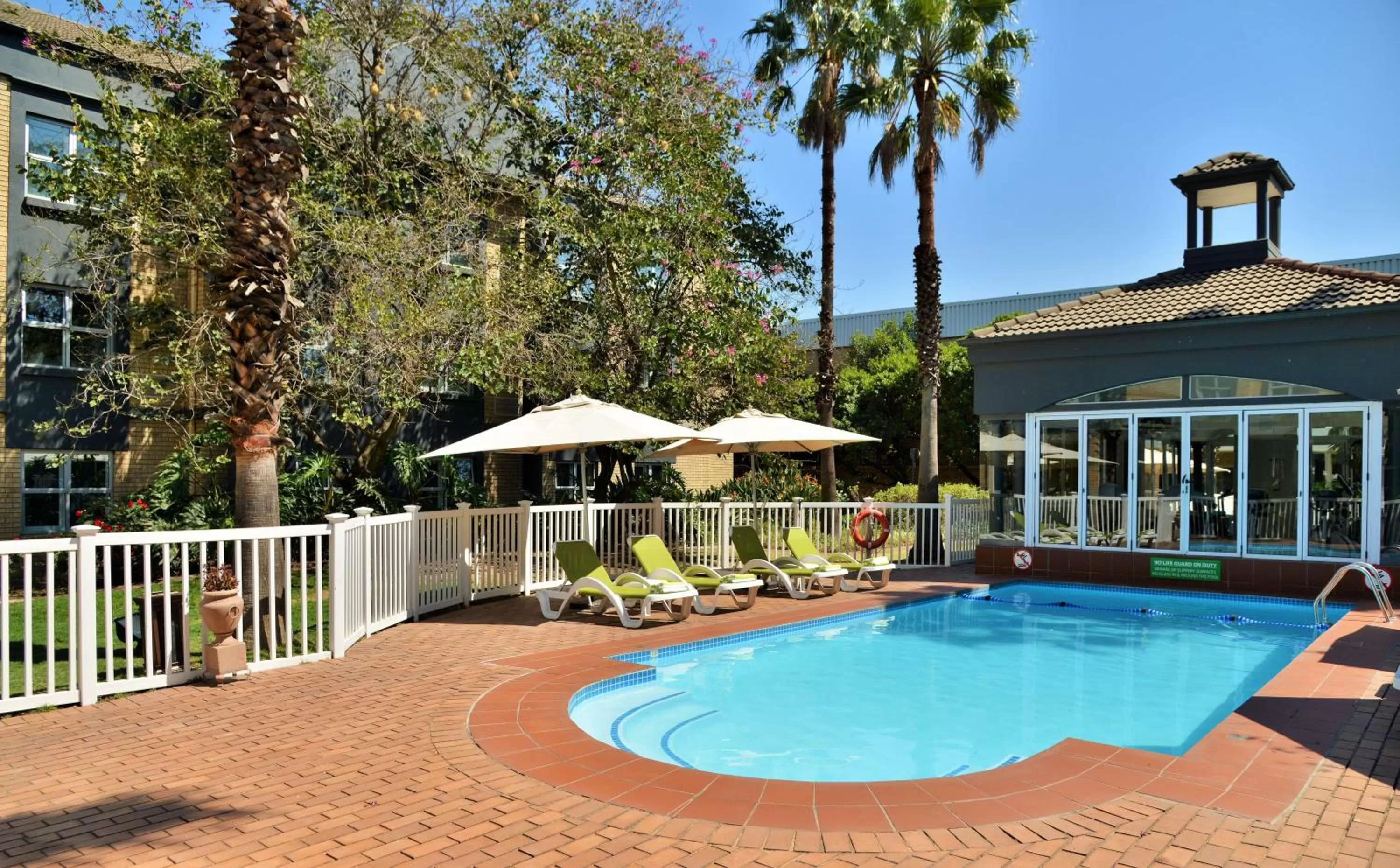 Swimming pool in Holiday Inn Johannesburg OR Tambo Airport Hotel by IHG