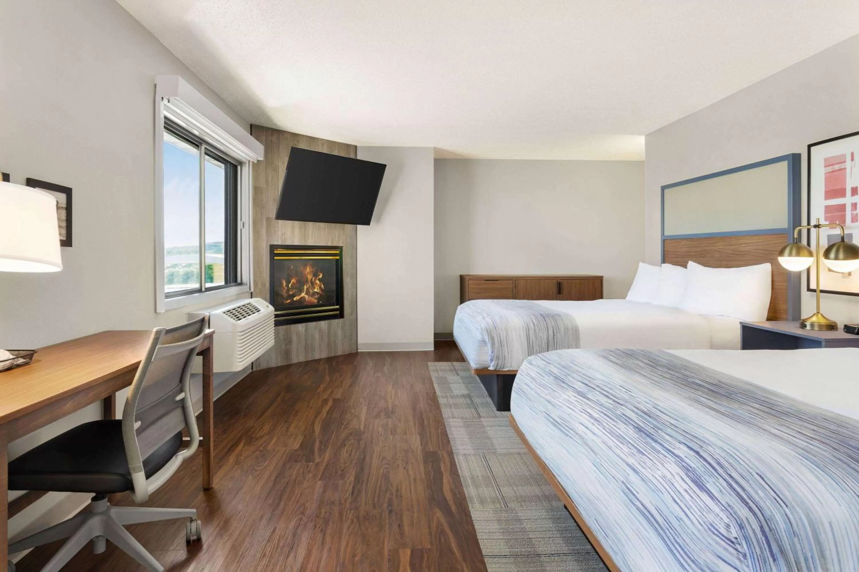 Bed in AmericInn by Wyndham Rapid City