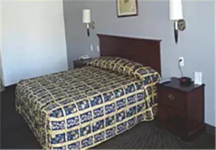 Bed in Texas Inn & Suites