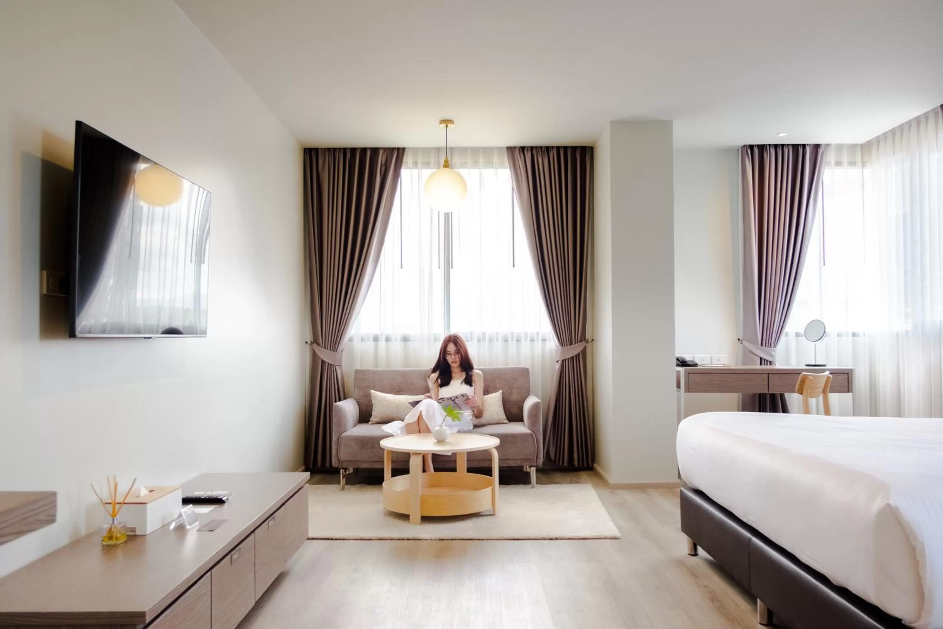 Photo of the whole room, Bed in The Rise Suites Hotel, Chiang Mai - SHA Extra Plus