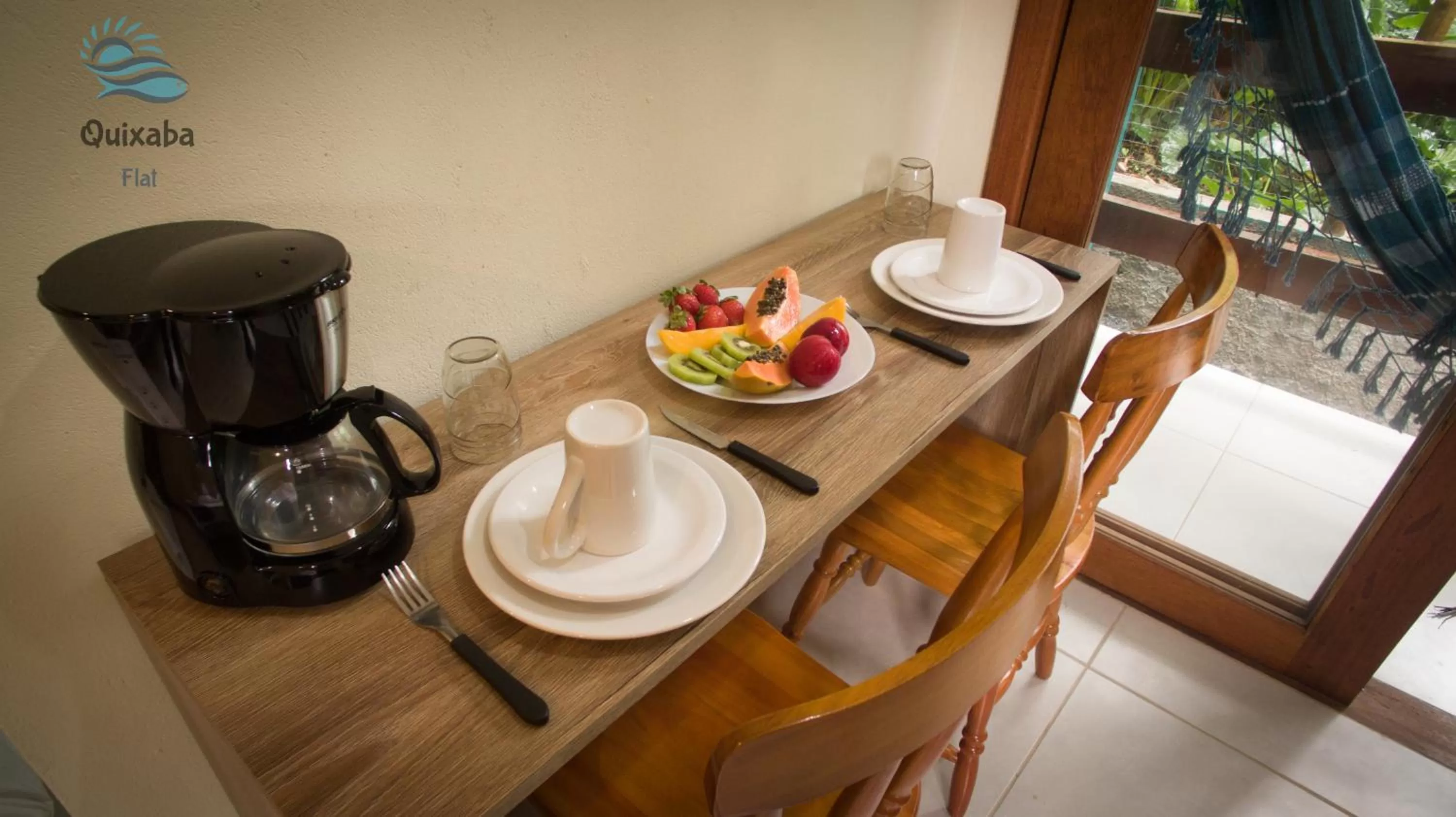 Dining area in i9 Quixaba Flat