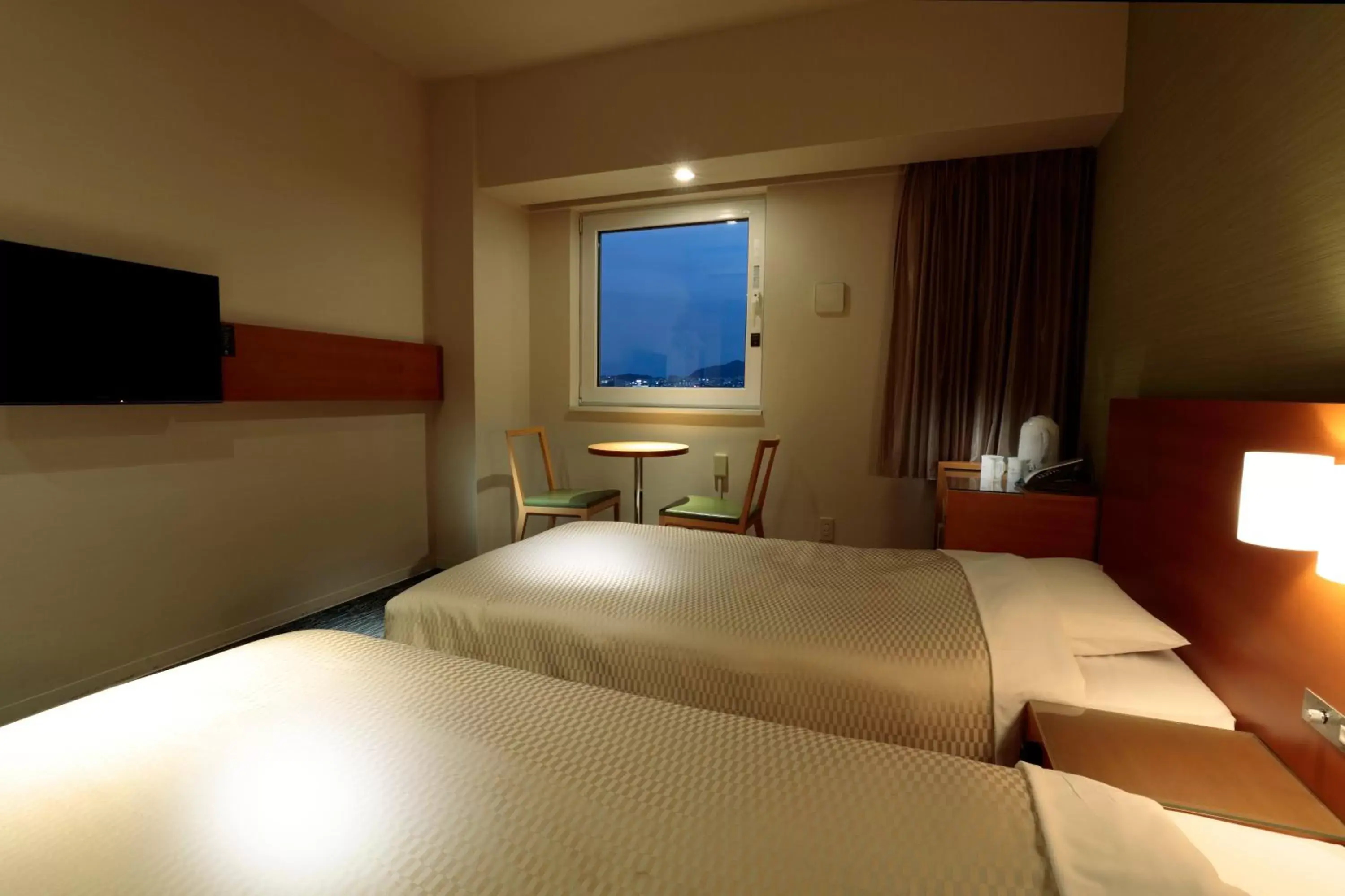 Bed in Candeo Hotels Fukuyama