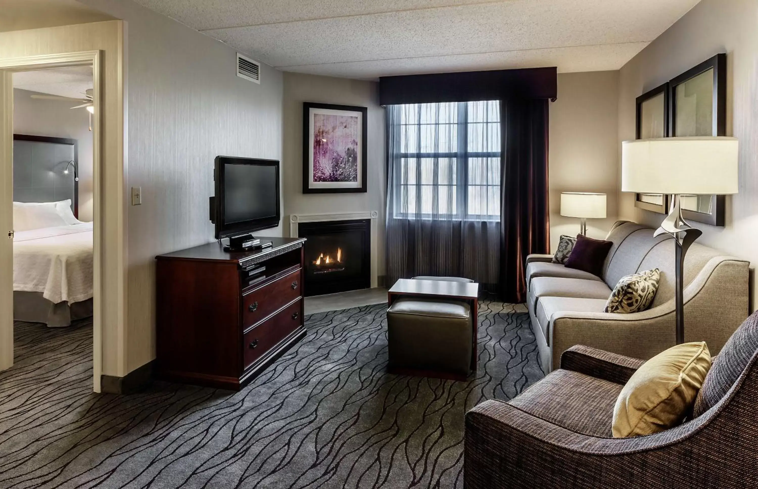 Bedroom, TV/Entertainment Center in Homewood Suites by Hilton Buffalo/Airport