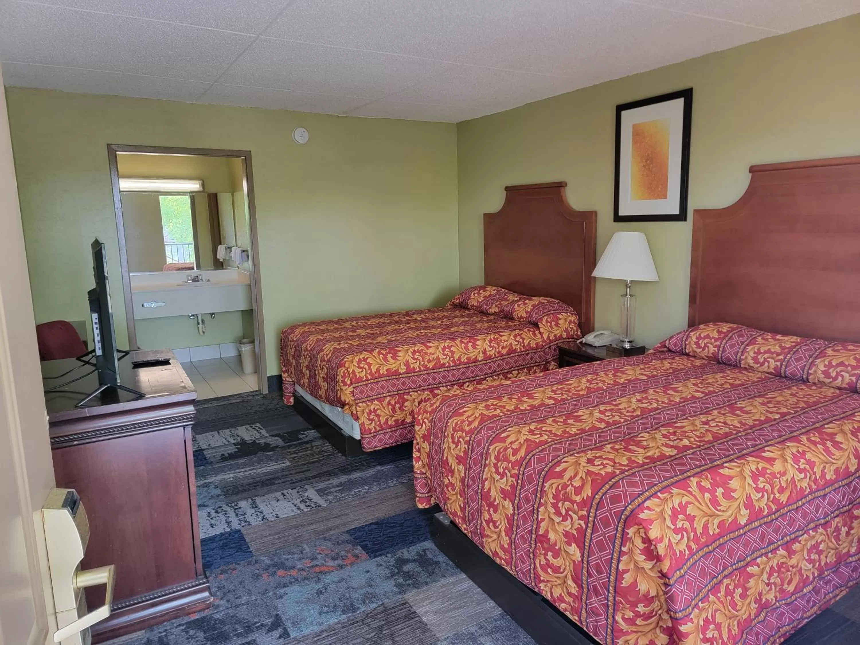Bed in Studio 9 Inn & Suites