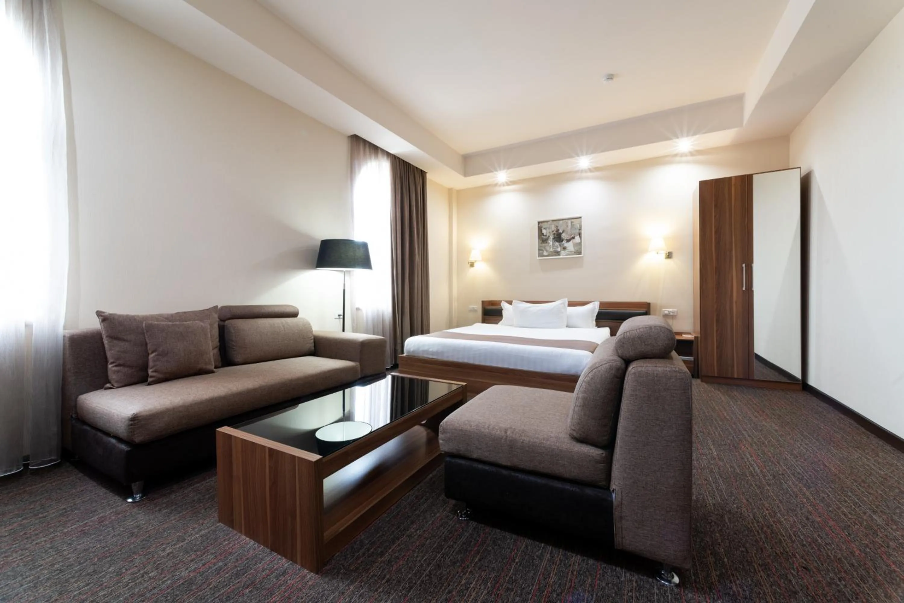 Living room, Bed in Bass Boutique Hotel