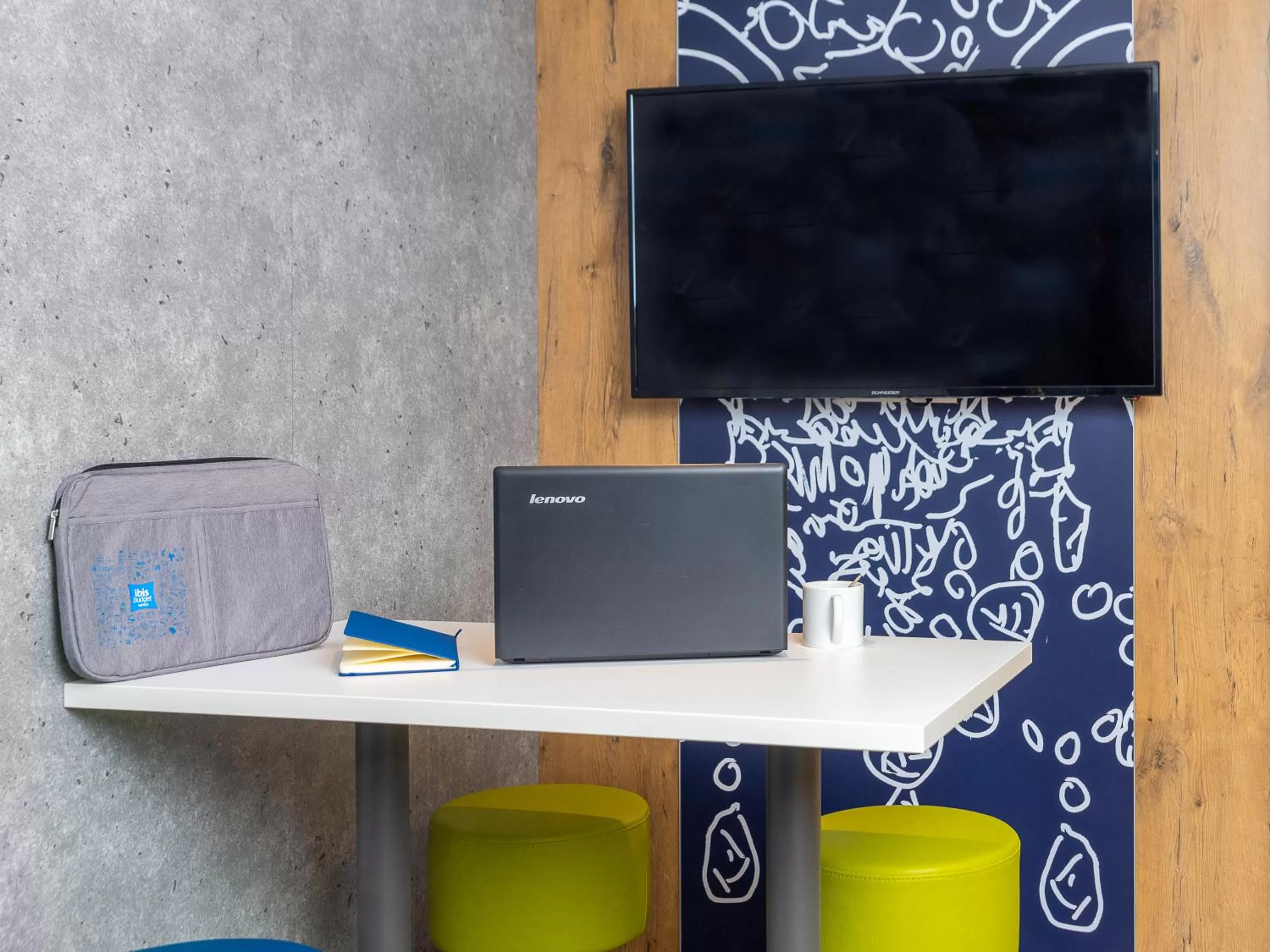 Communal lounge/ TV room in ibis Budget Cognac