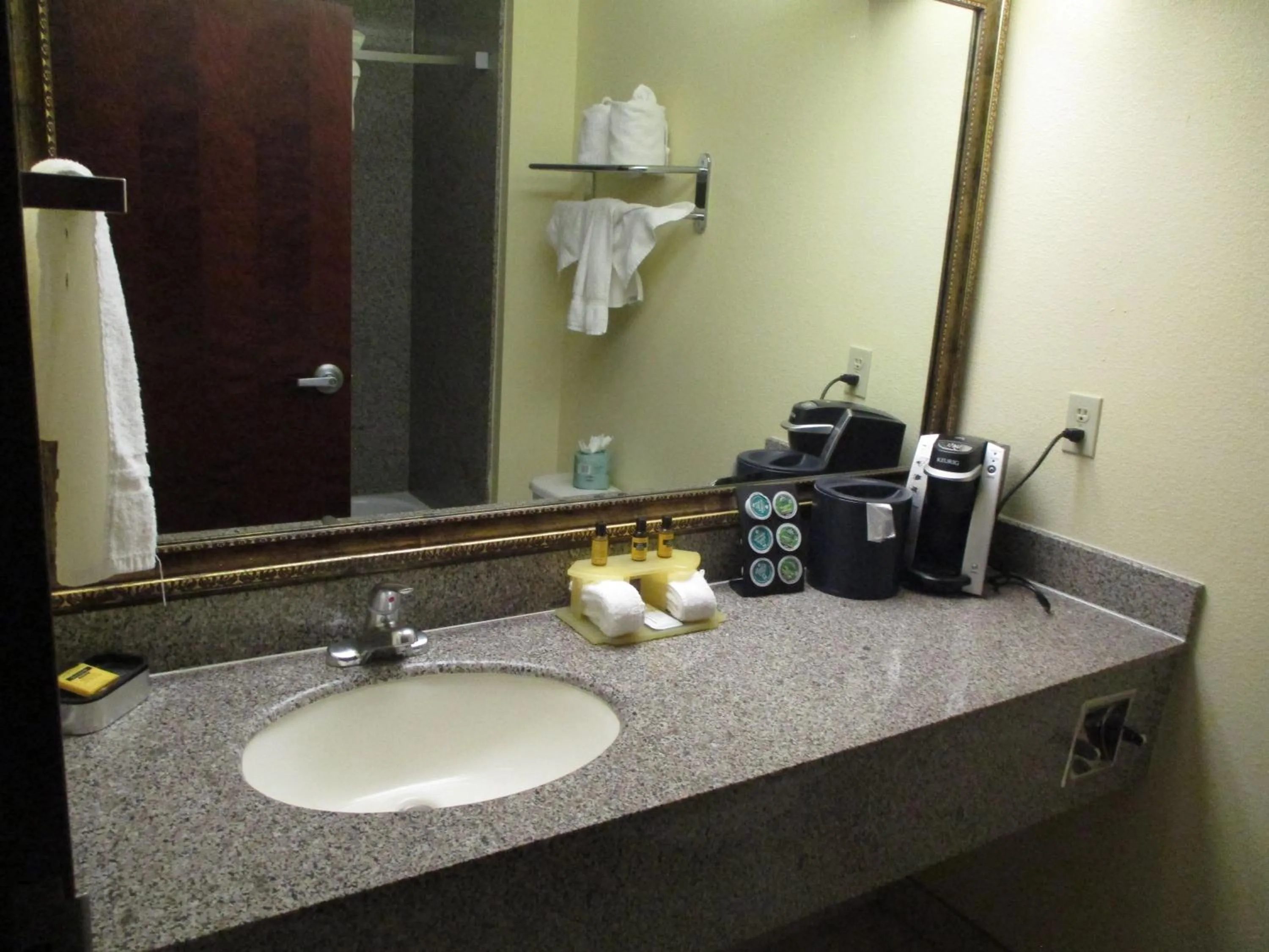 Bathroom in Days Inn & Suites by Wyndham Sam Houston Tollway