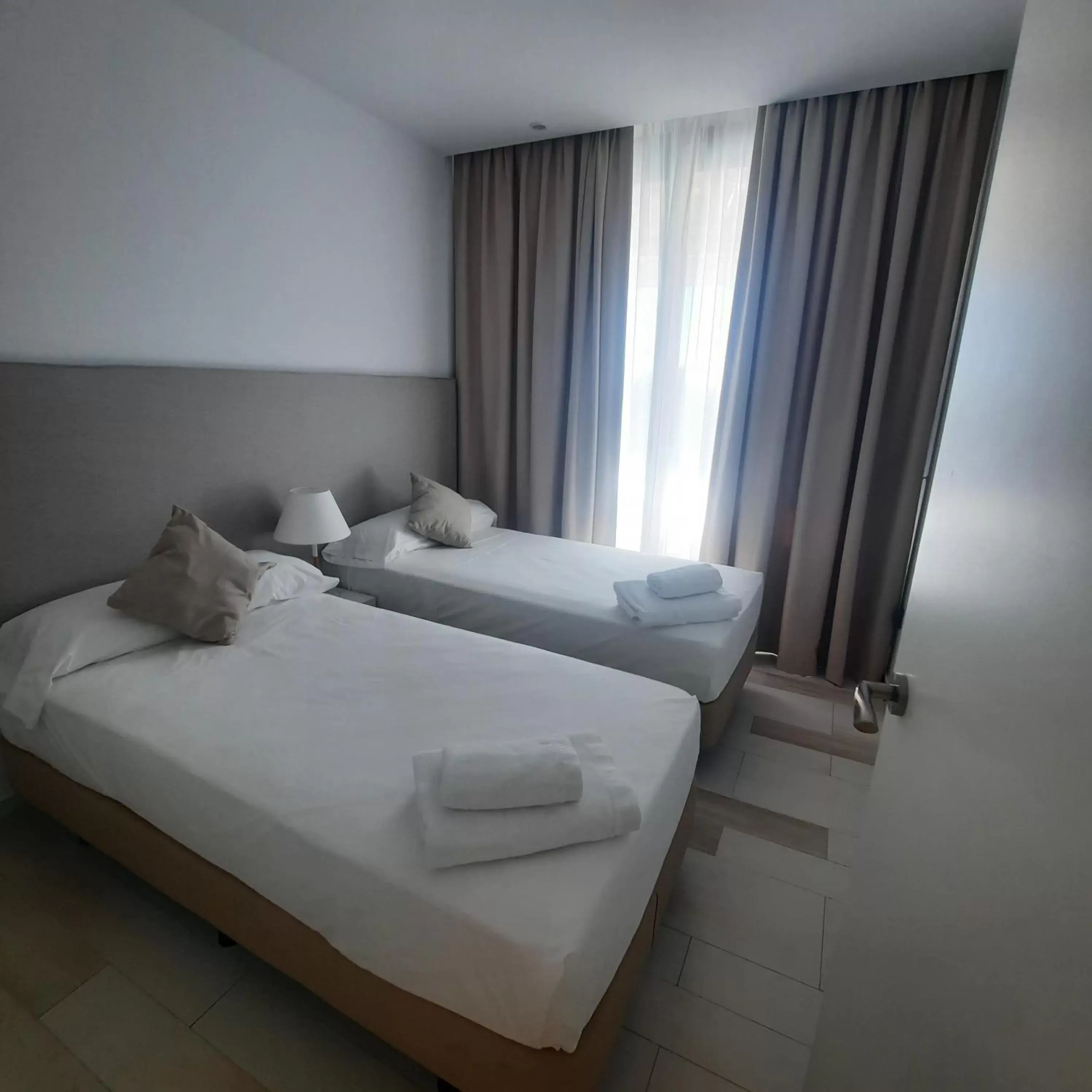 Bed in AZAHAR BEACH Apartments & Spa