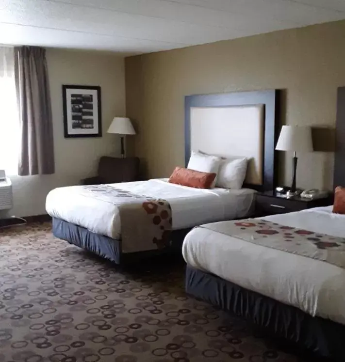 Bed in AmericInn by Wyndham Cedar Falls