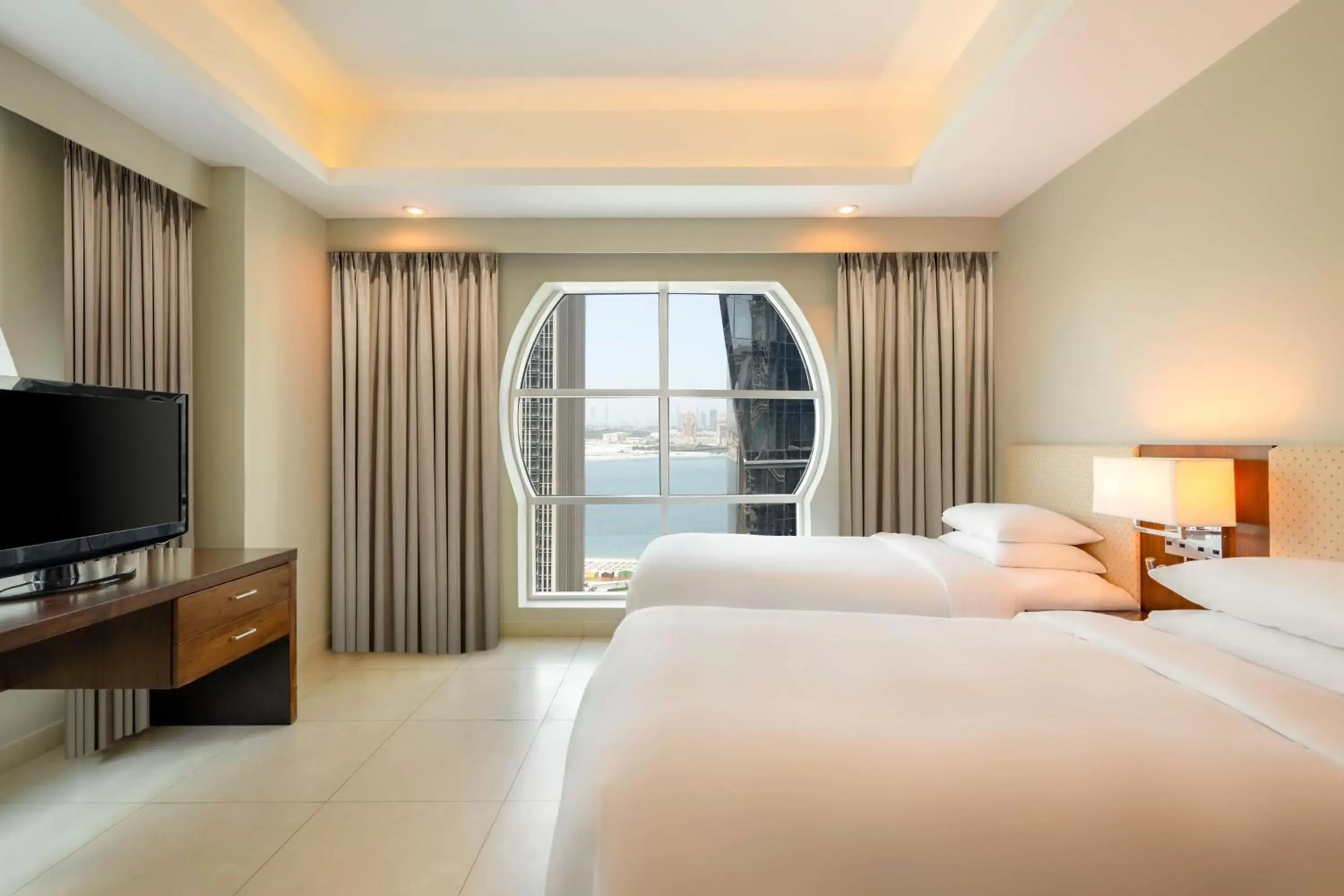 Bedroom, TV/Entertainment Center in Marriott Executive Apartments City Center Doha