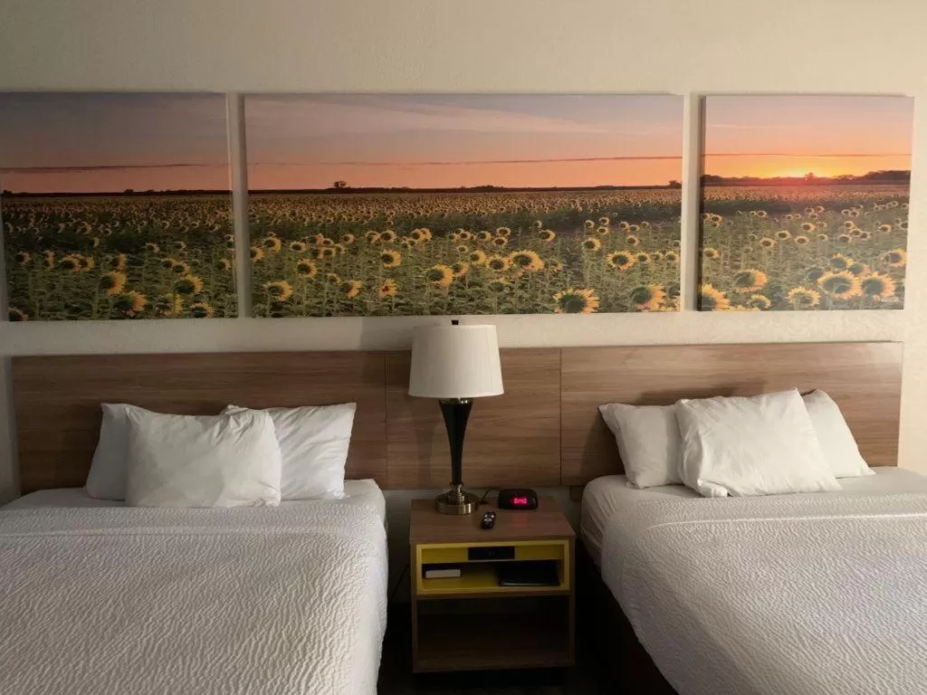 Bed in Days Inn by Wyndham Topeka