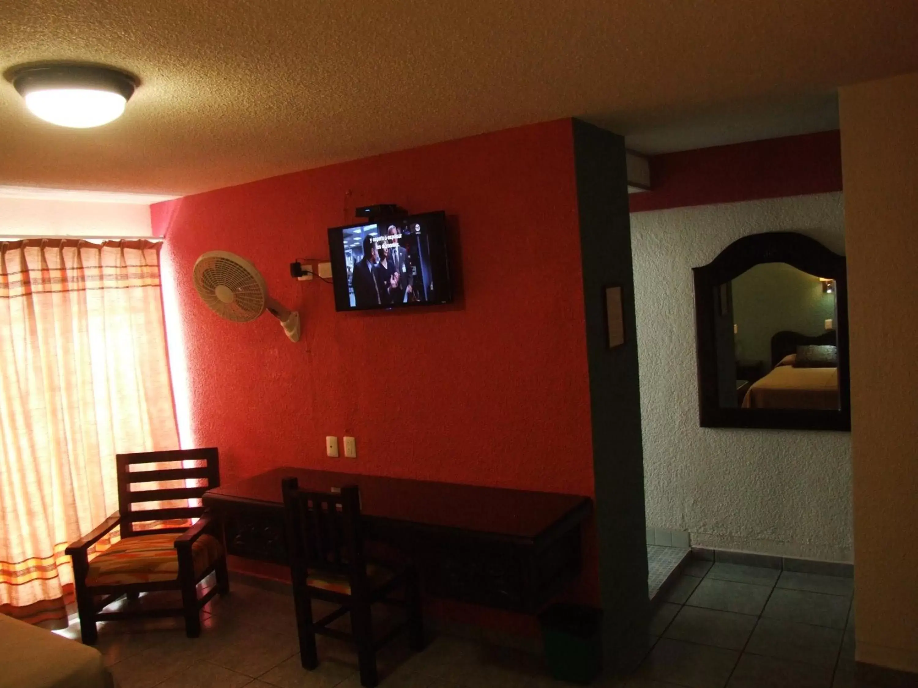 Bedroom, TV/Entertainment Center in Hotel Aurora