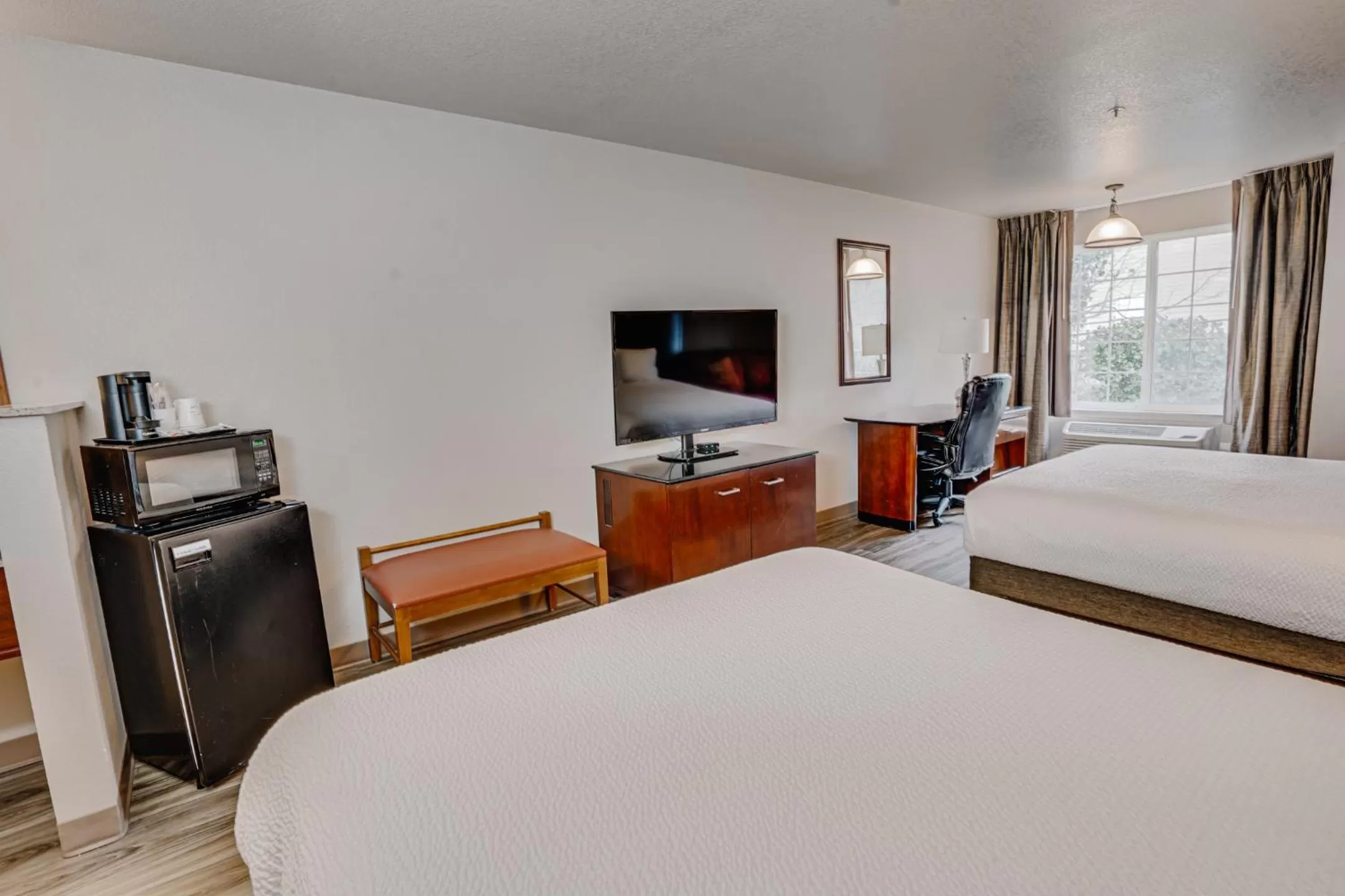 Bed in The Ashley Inn & Suites