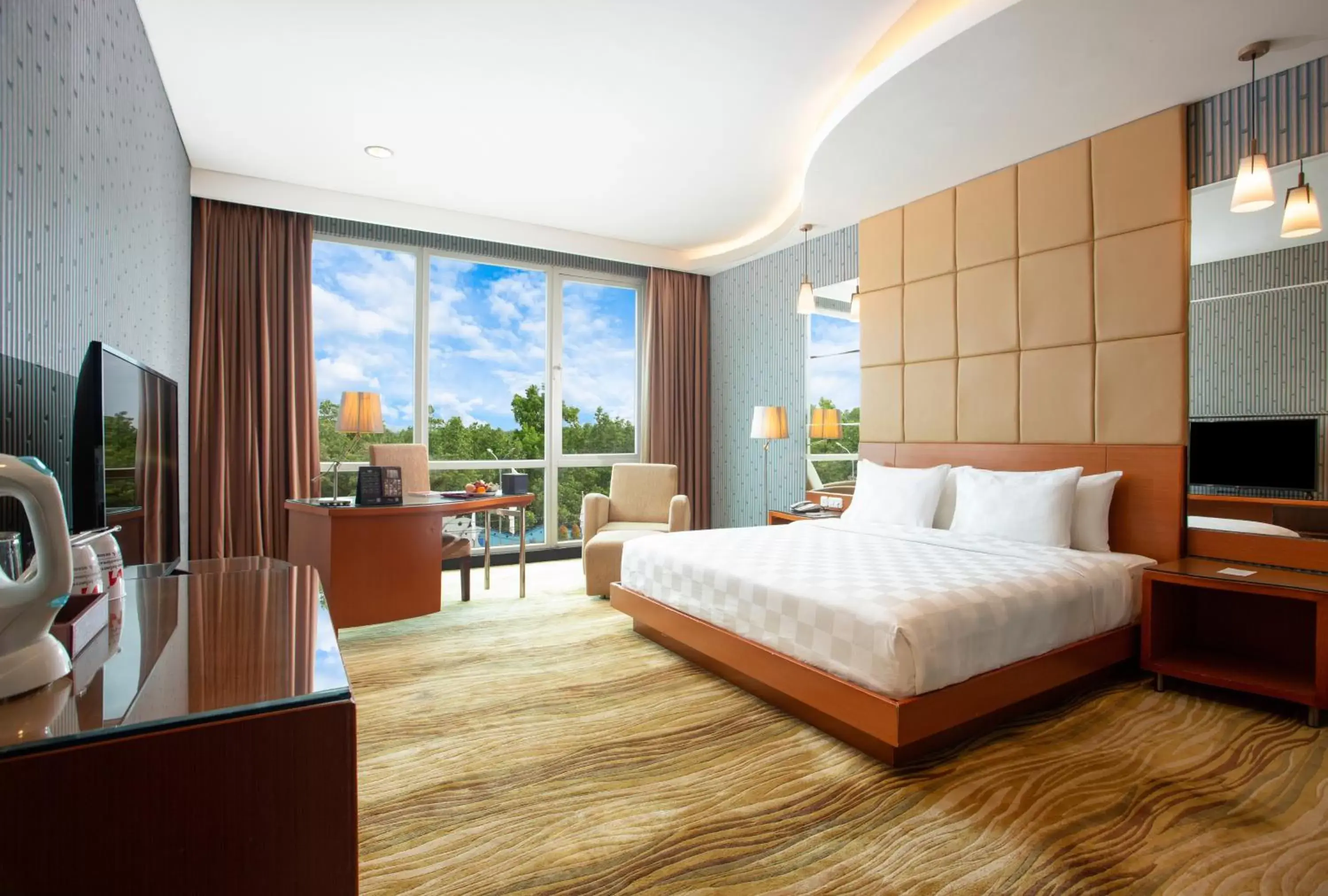 Bed in Swiss-Belhotel Kendari