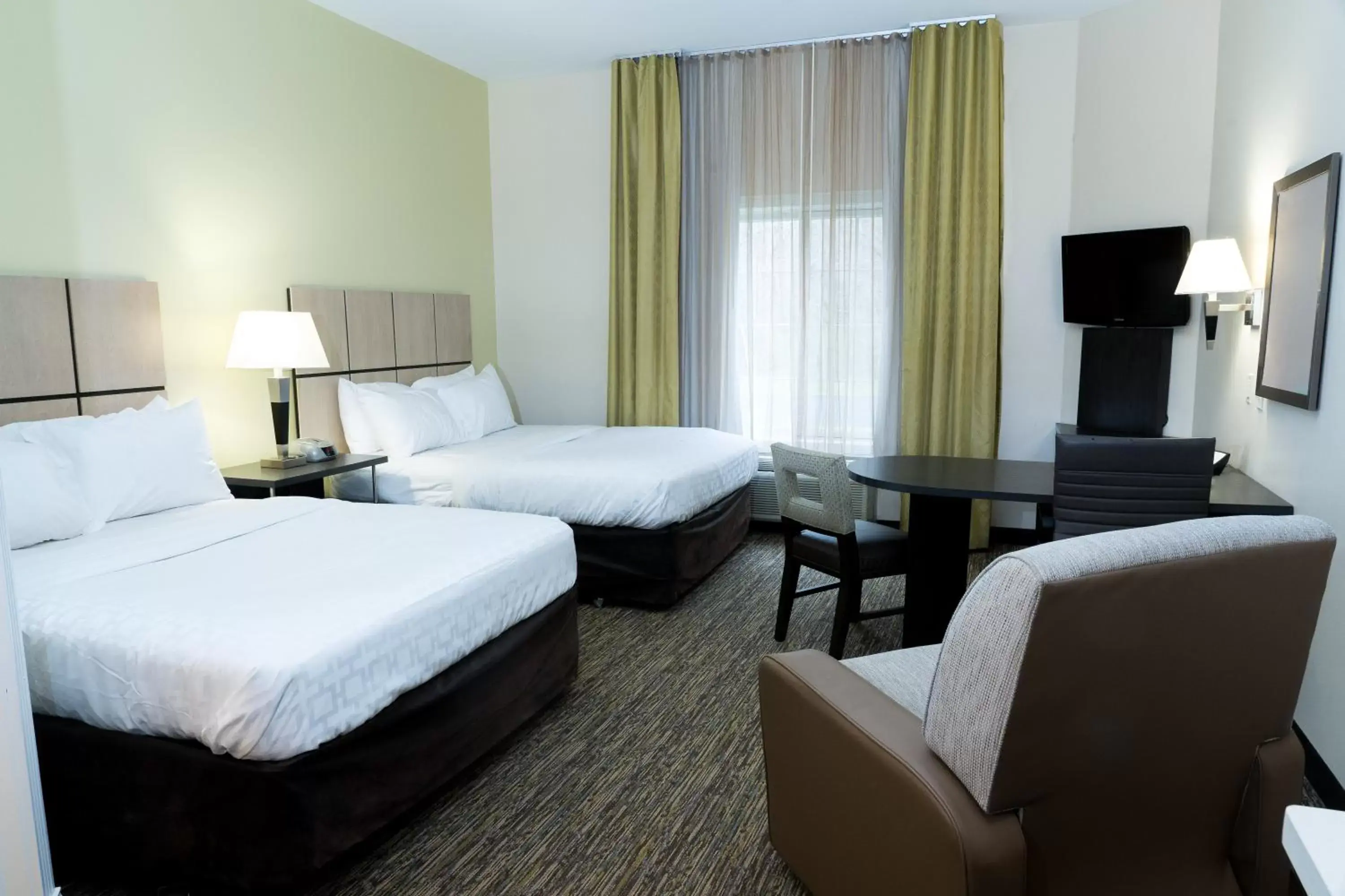 Photo of the whole room, Bed in Candlewood Suites Saint Joseph - Benton Harbor, an IHG Hotel