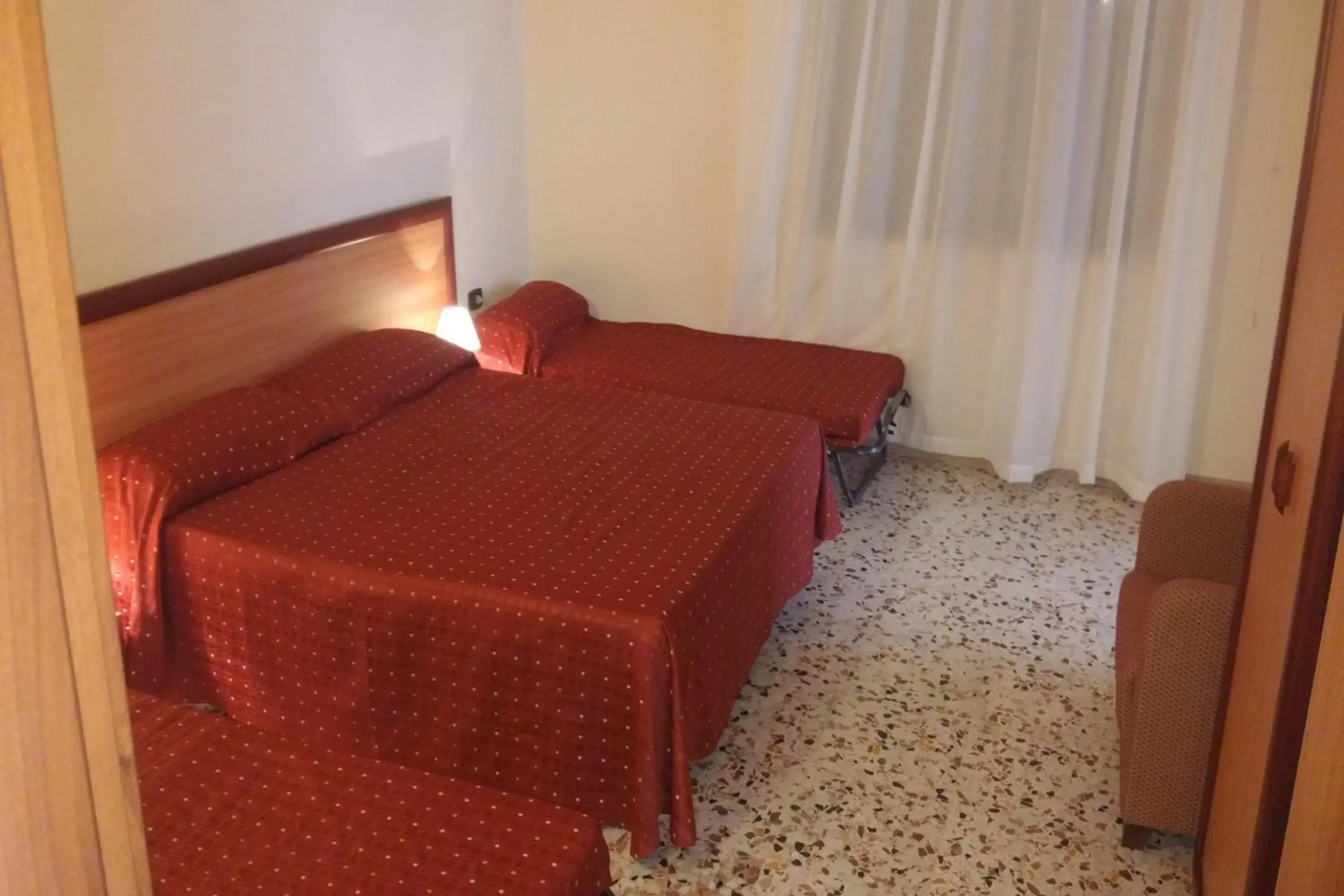 Quadruple Room in Hotel La Casa Del Pellegrino Quadruple Room in Hotel La Casa Del Pellegrino