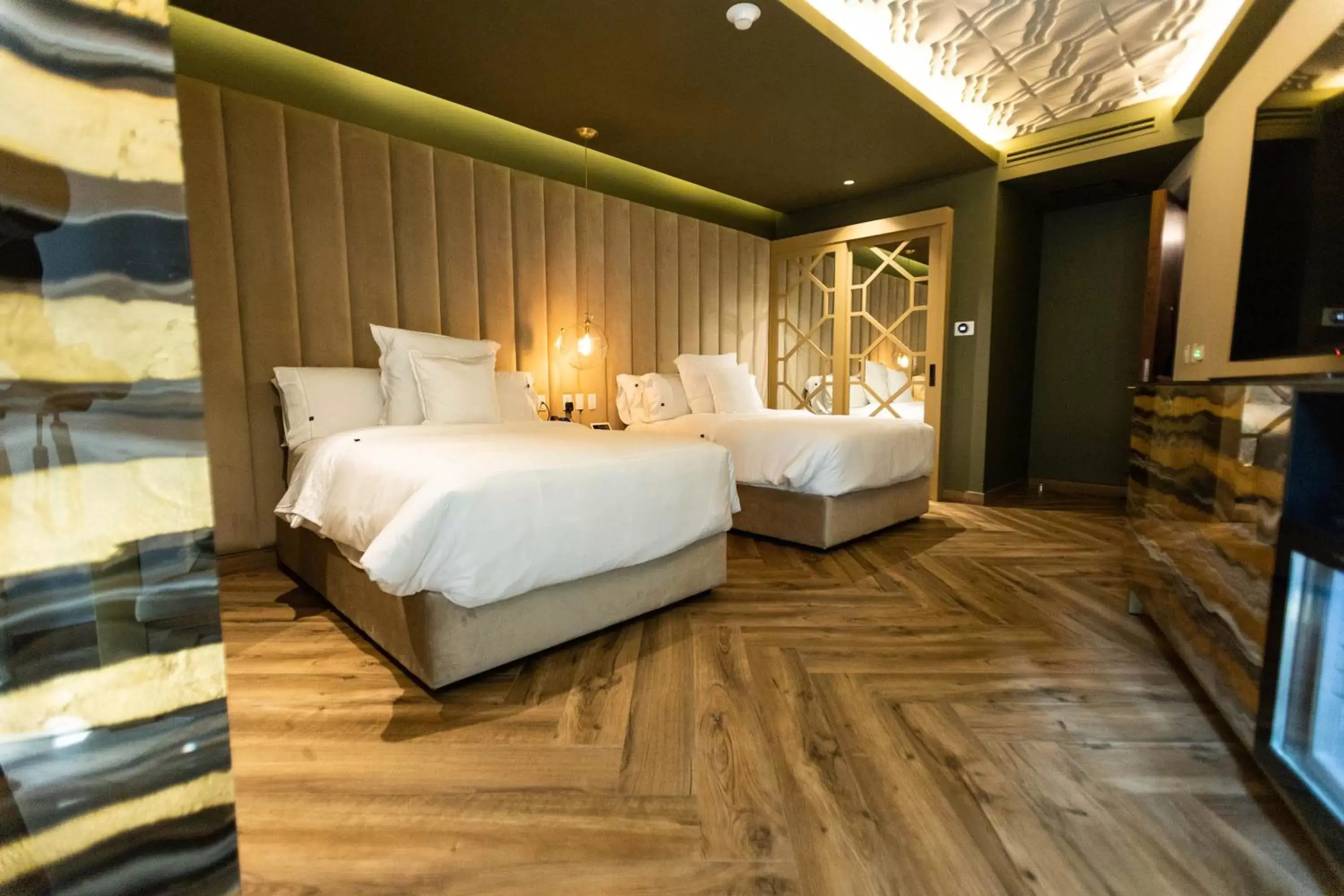 Bed in L Hotel Perla Boutique