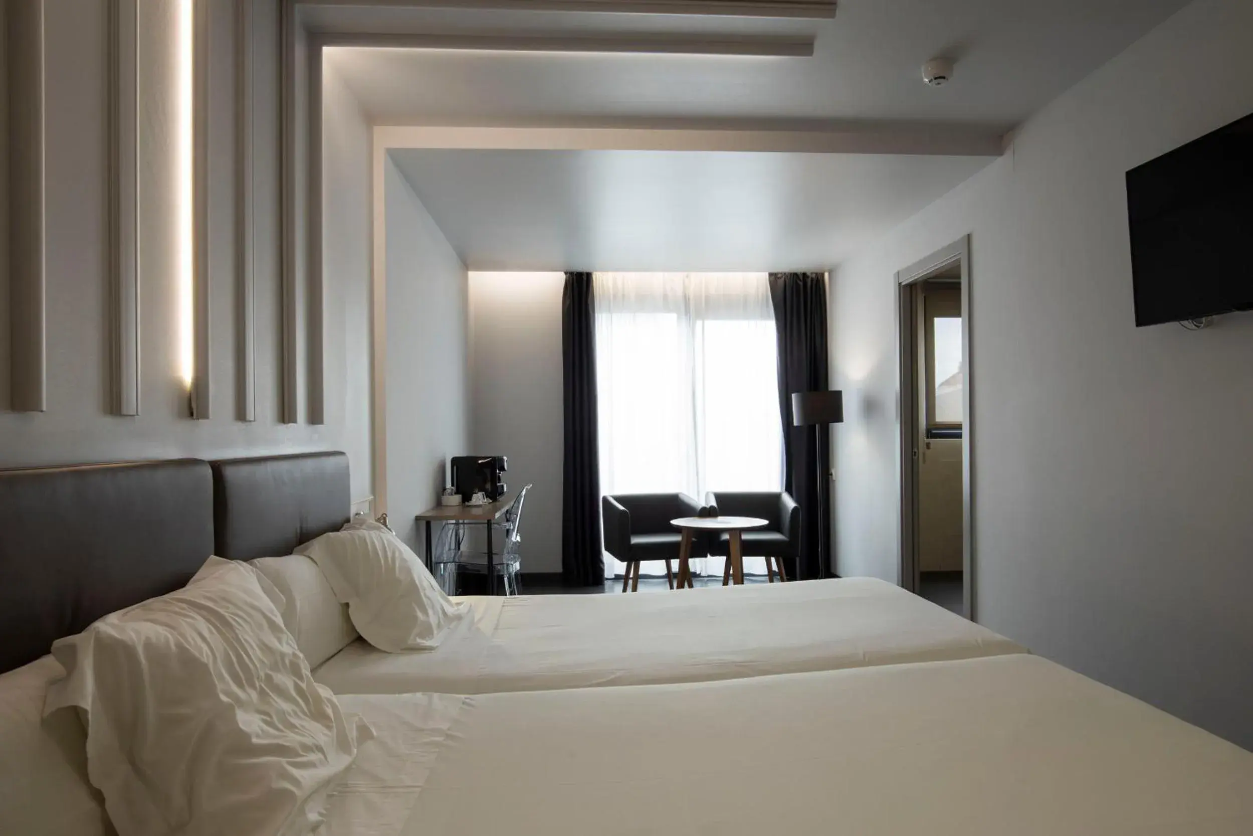 Photo of the whole room, Bed in Hotel Lux Santiago