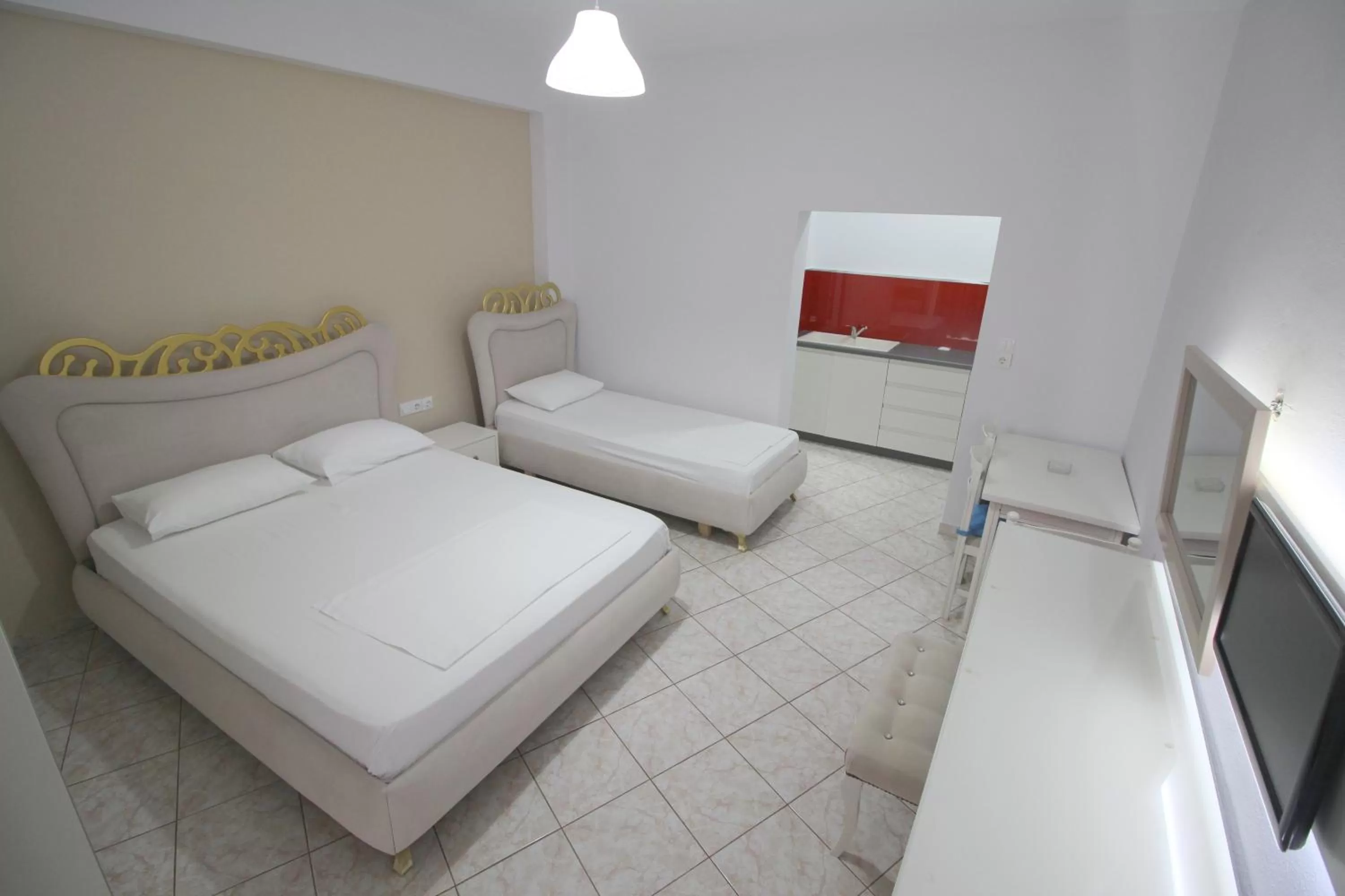 Bed in Murati Suites Sarandë