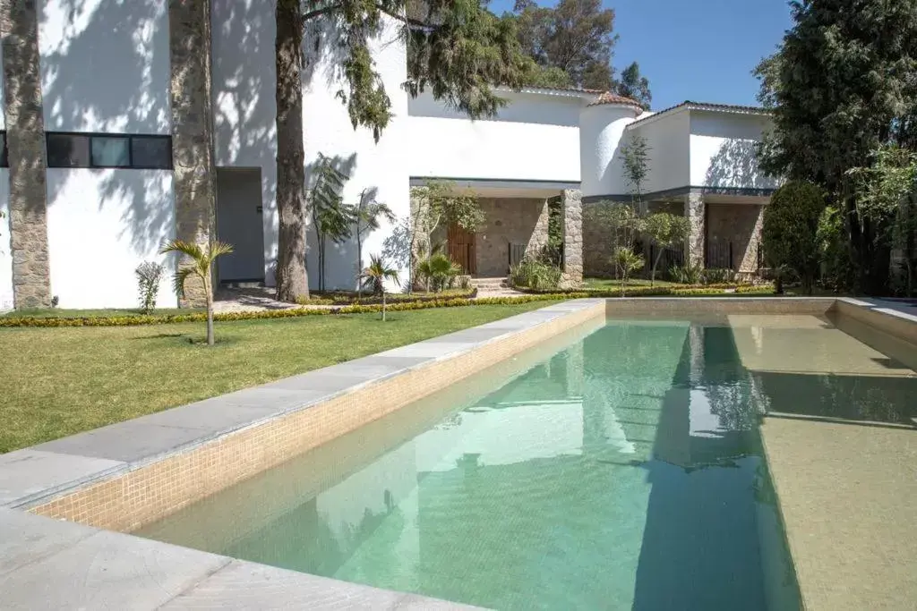 Swimming Pool in Hotel Boutique Camino Del Bosque by Rotamundos