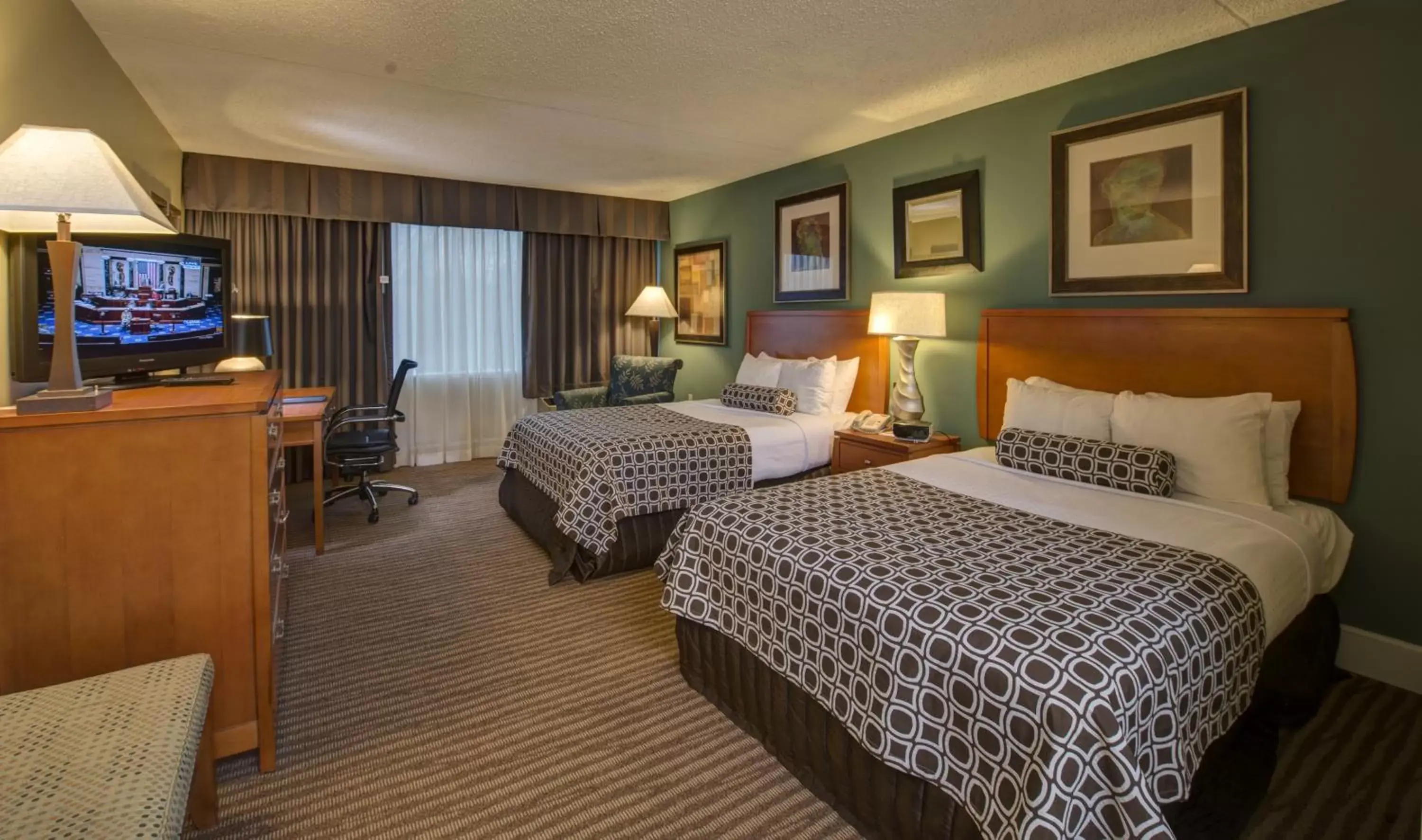 Bed in The Rockville Hotel, a Ramada by Wyndham