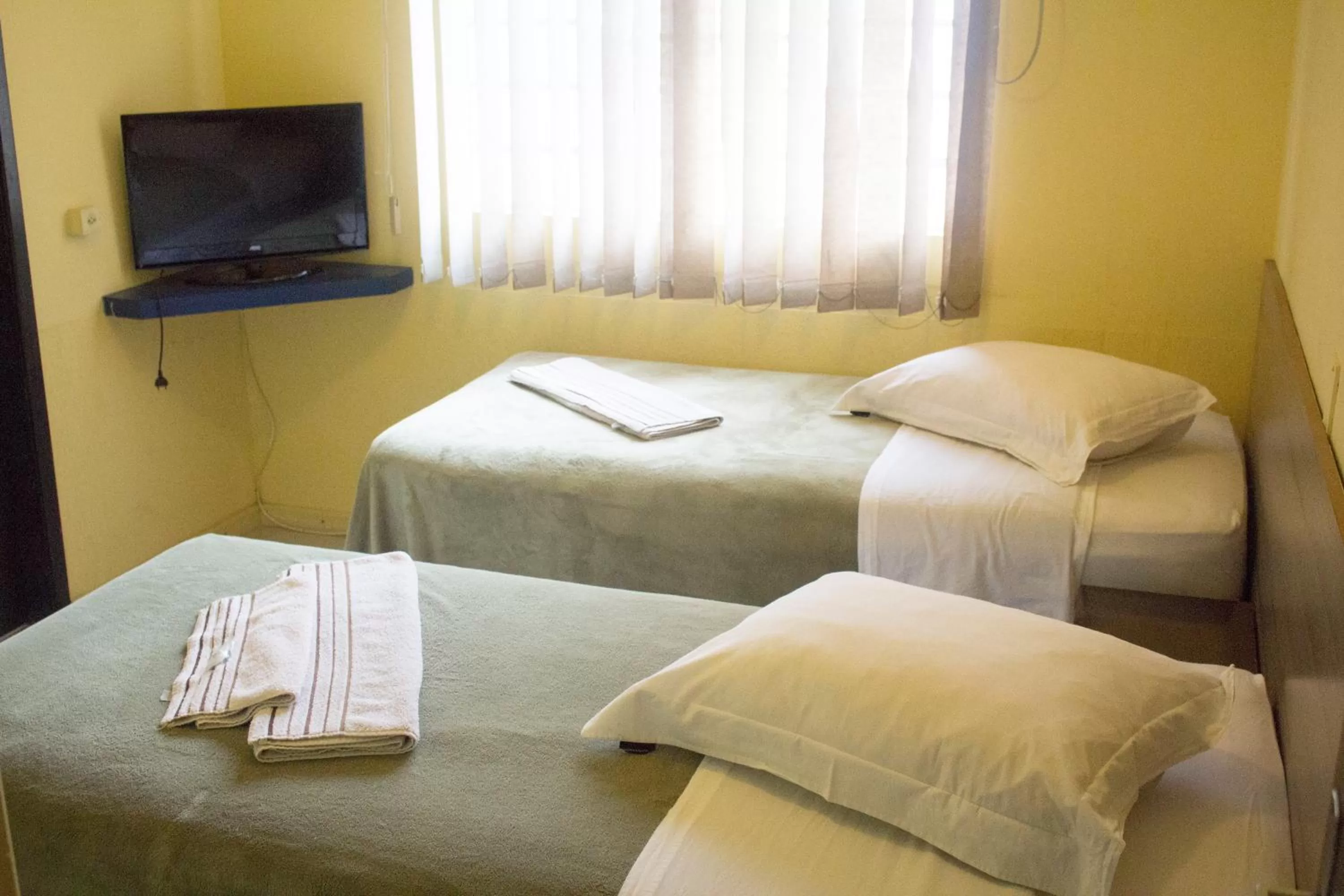 Bed in Hotel Dois Irmãos