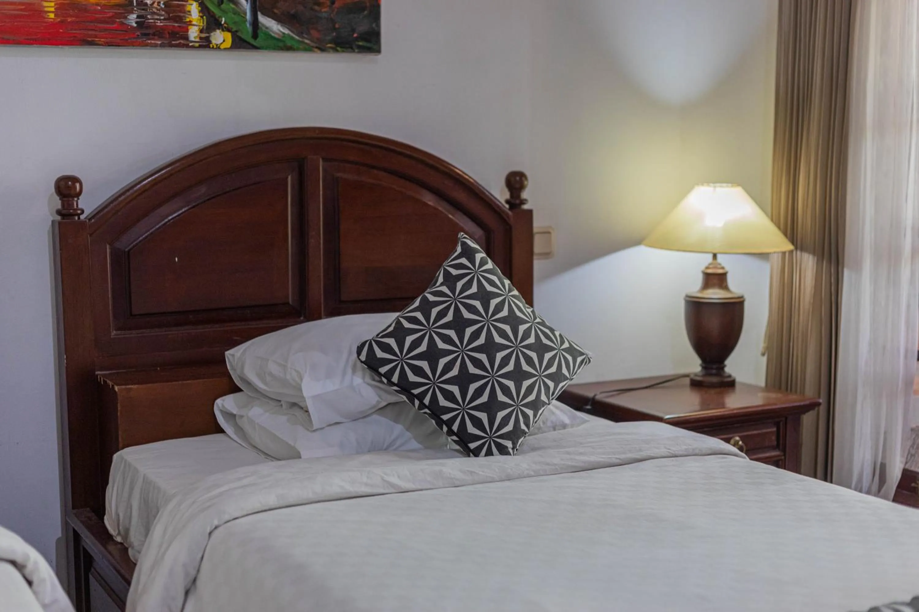 Bed in Puri Mango Guest House Sanur