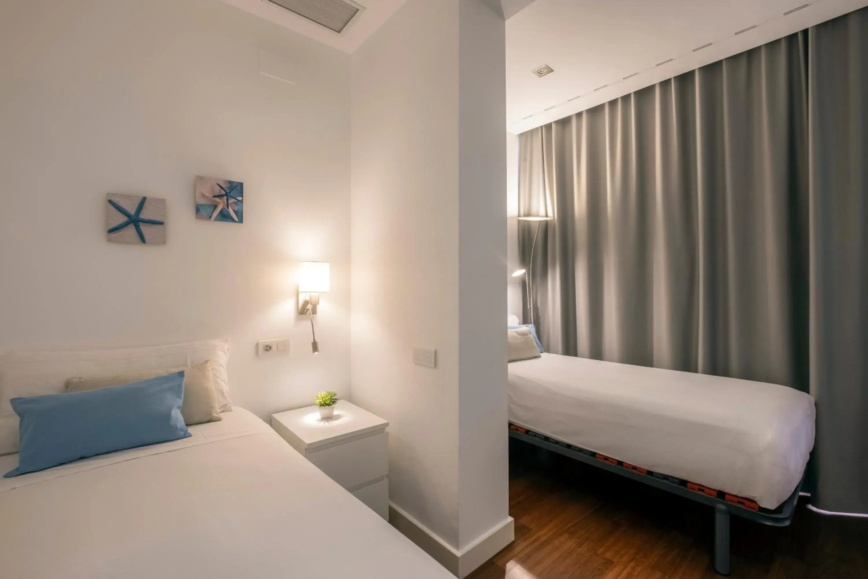 Bedroom, Bed in Paseo de Gracia Bas Apartments by Aspasios