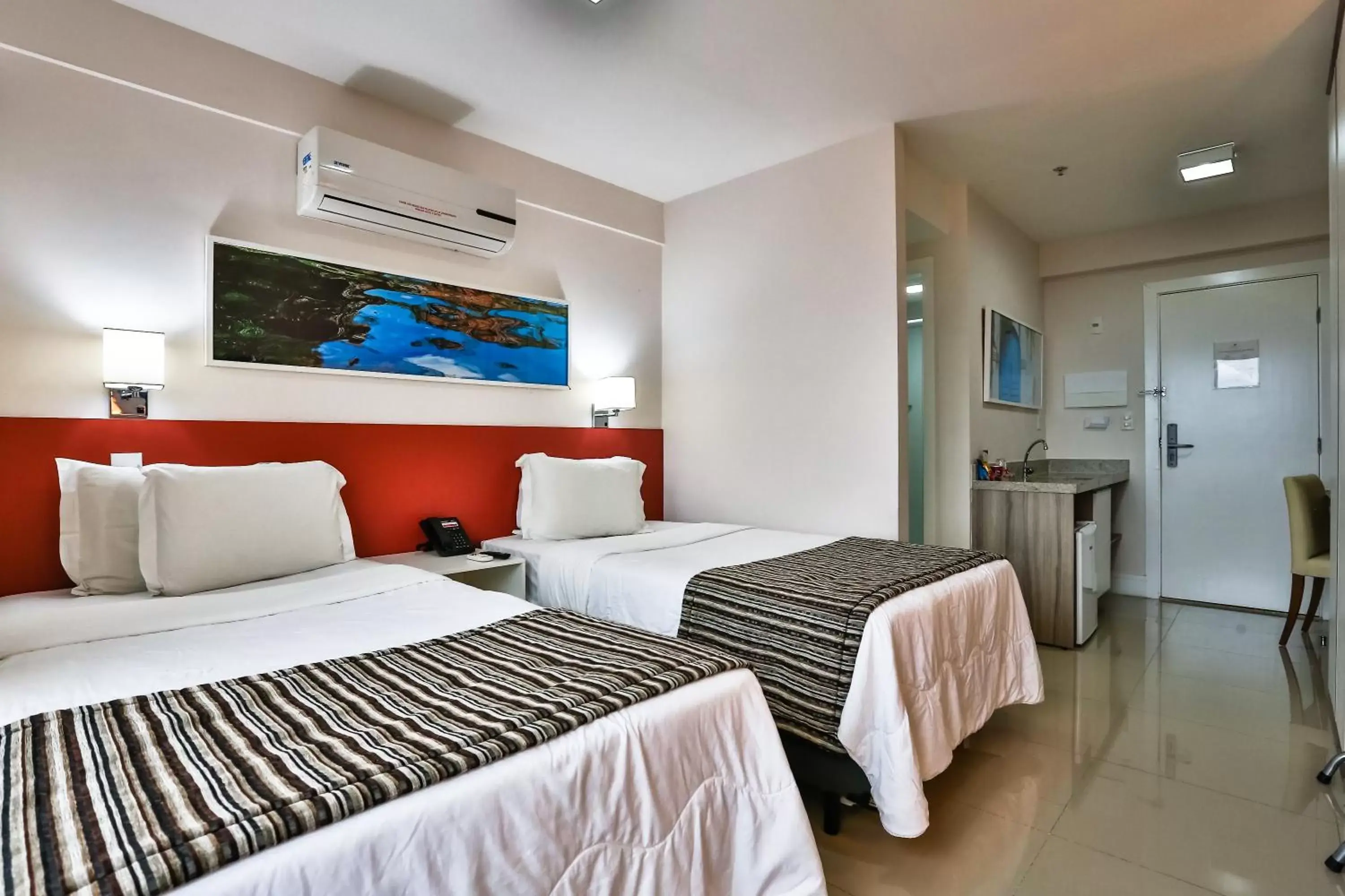 Bedroom, Bed in Ramada Hotel & Suites Campos Pelinca