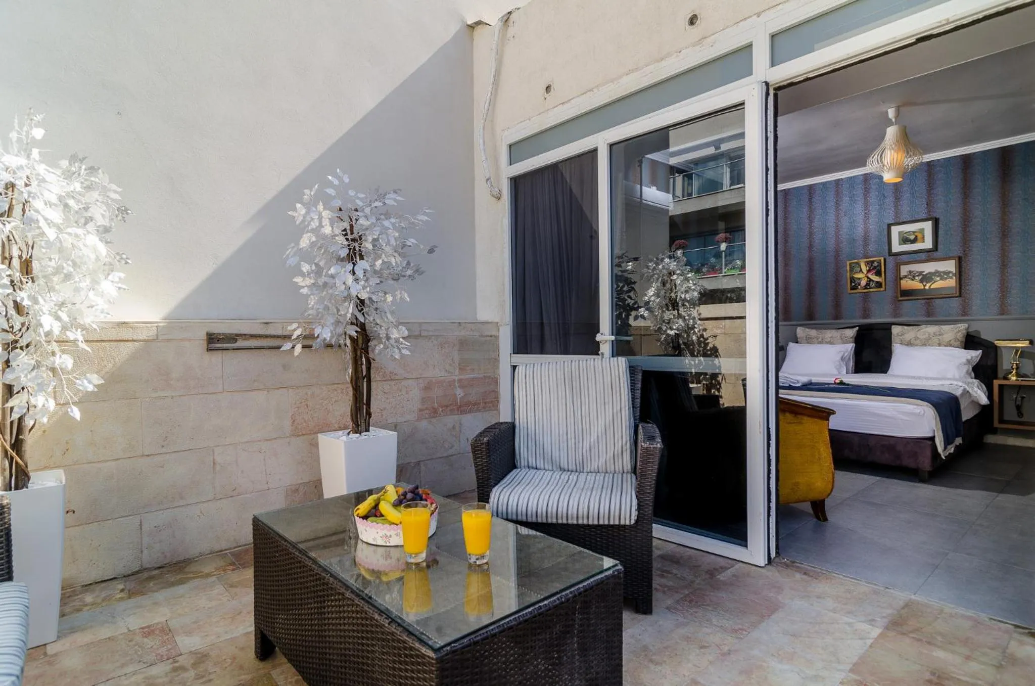 Bed, Patio/Outdoor Area in Ness Hotel